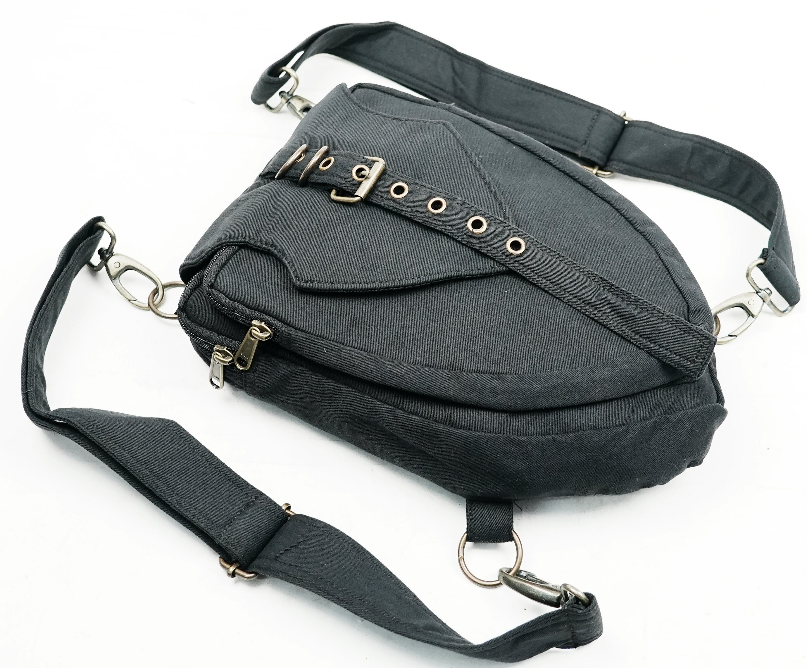 Unisex canvas shoulder bag featuring multi-way clips and a secure front pocket