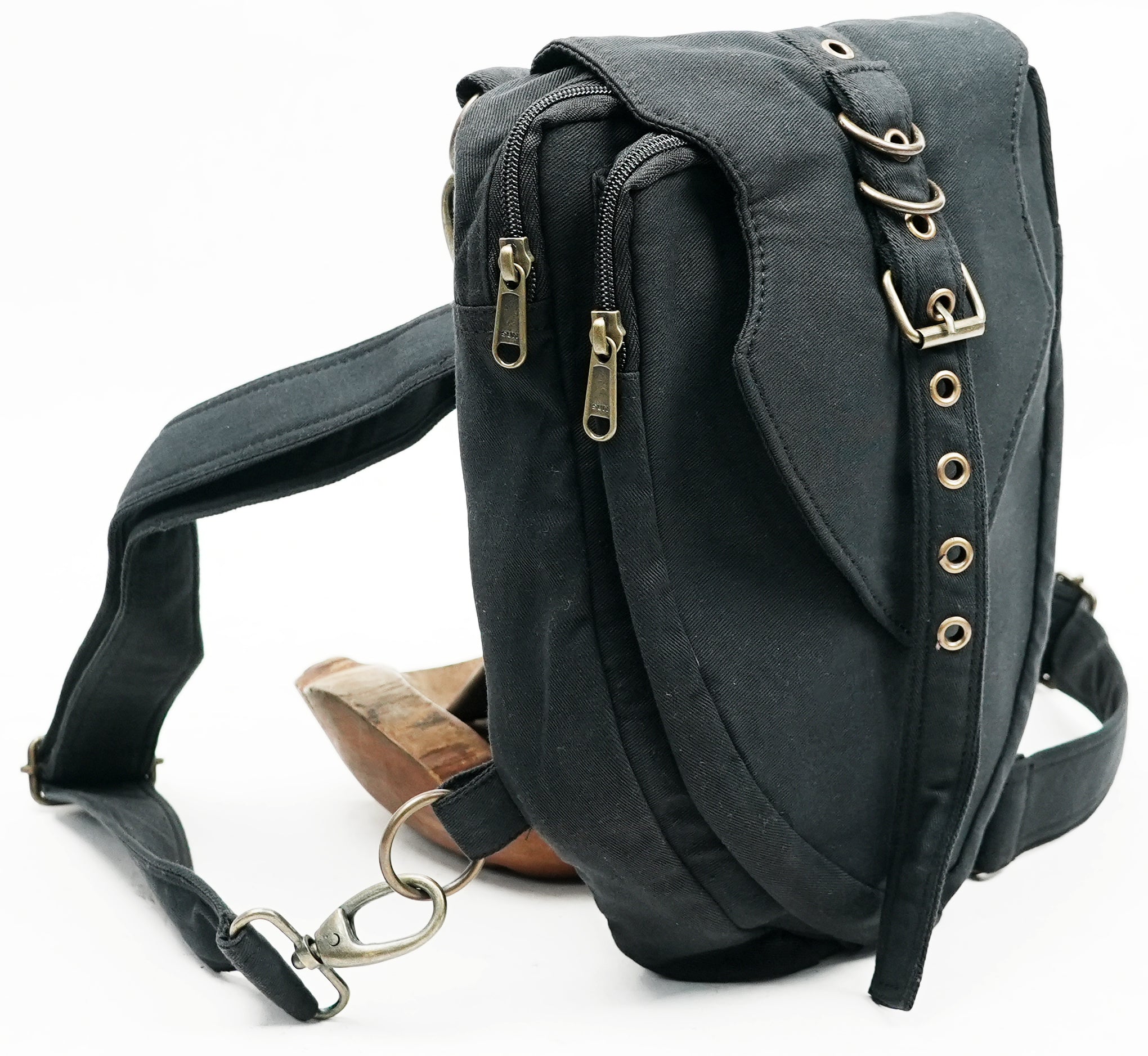 Versatile multi-way canvas pack with a distinctive front buckle accent