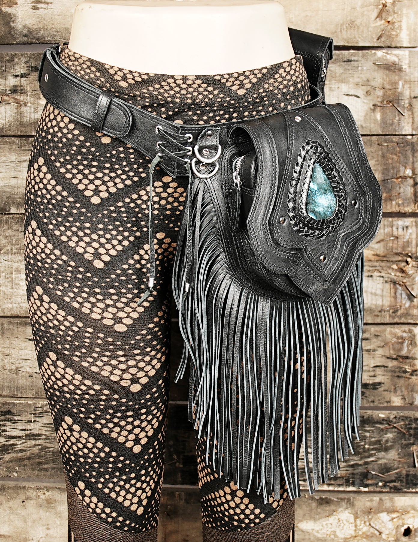 Artisan leather hip bag with textured fringe and gemstone embellishment