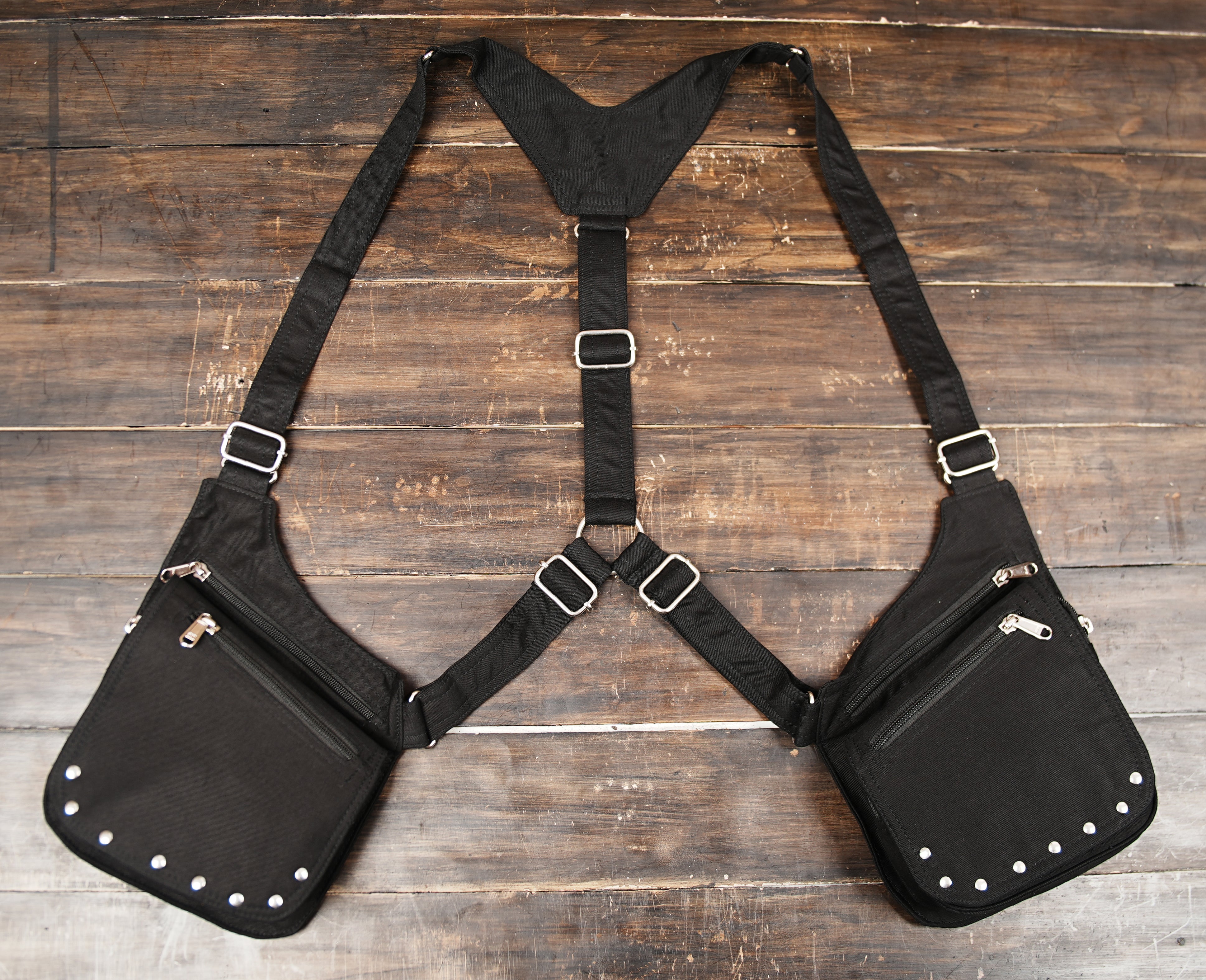 Double shoulder harness bag featuring metallic stud accents and silver hardware