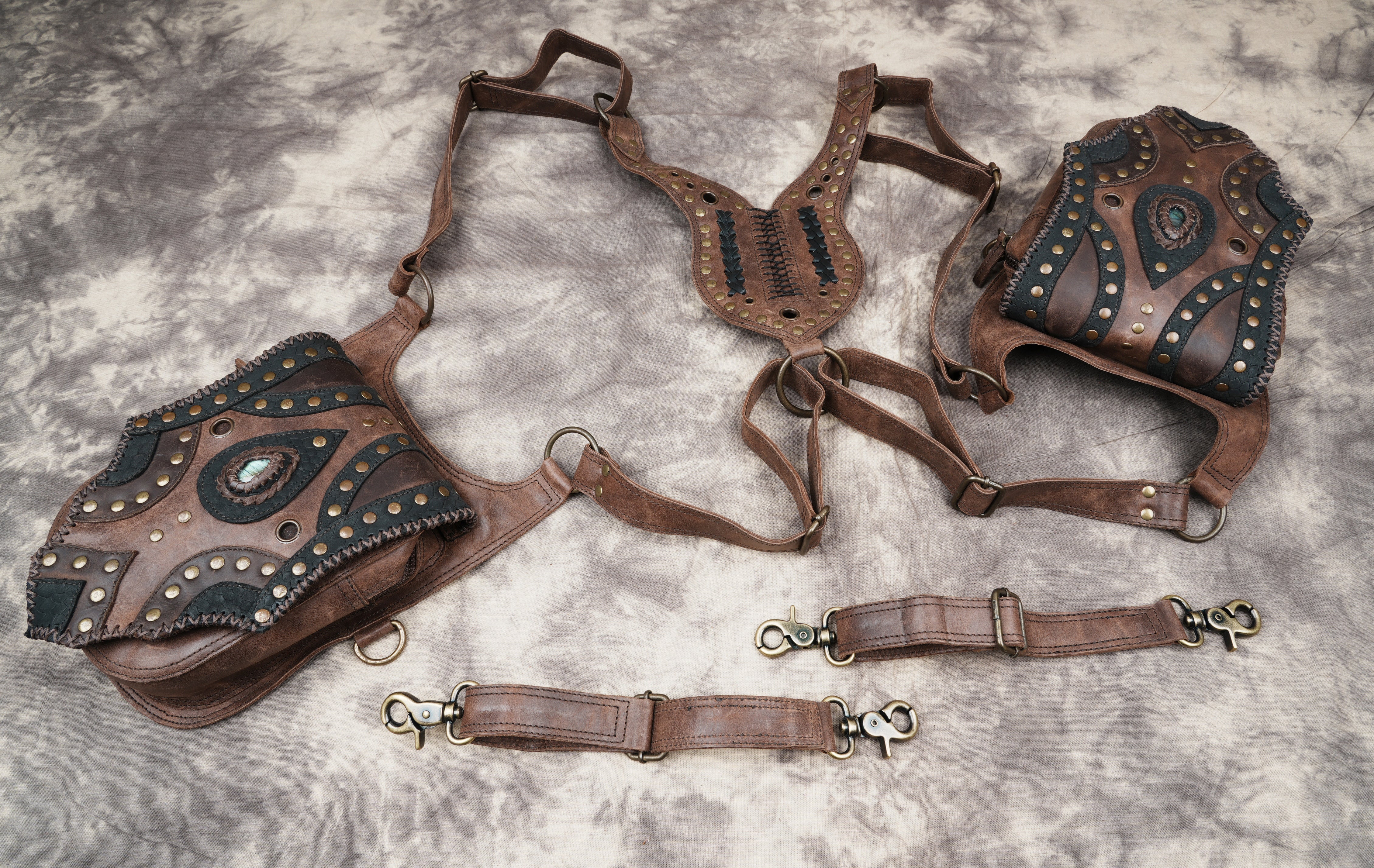 Decorative leather holster with embossed patterns and studs