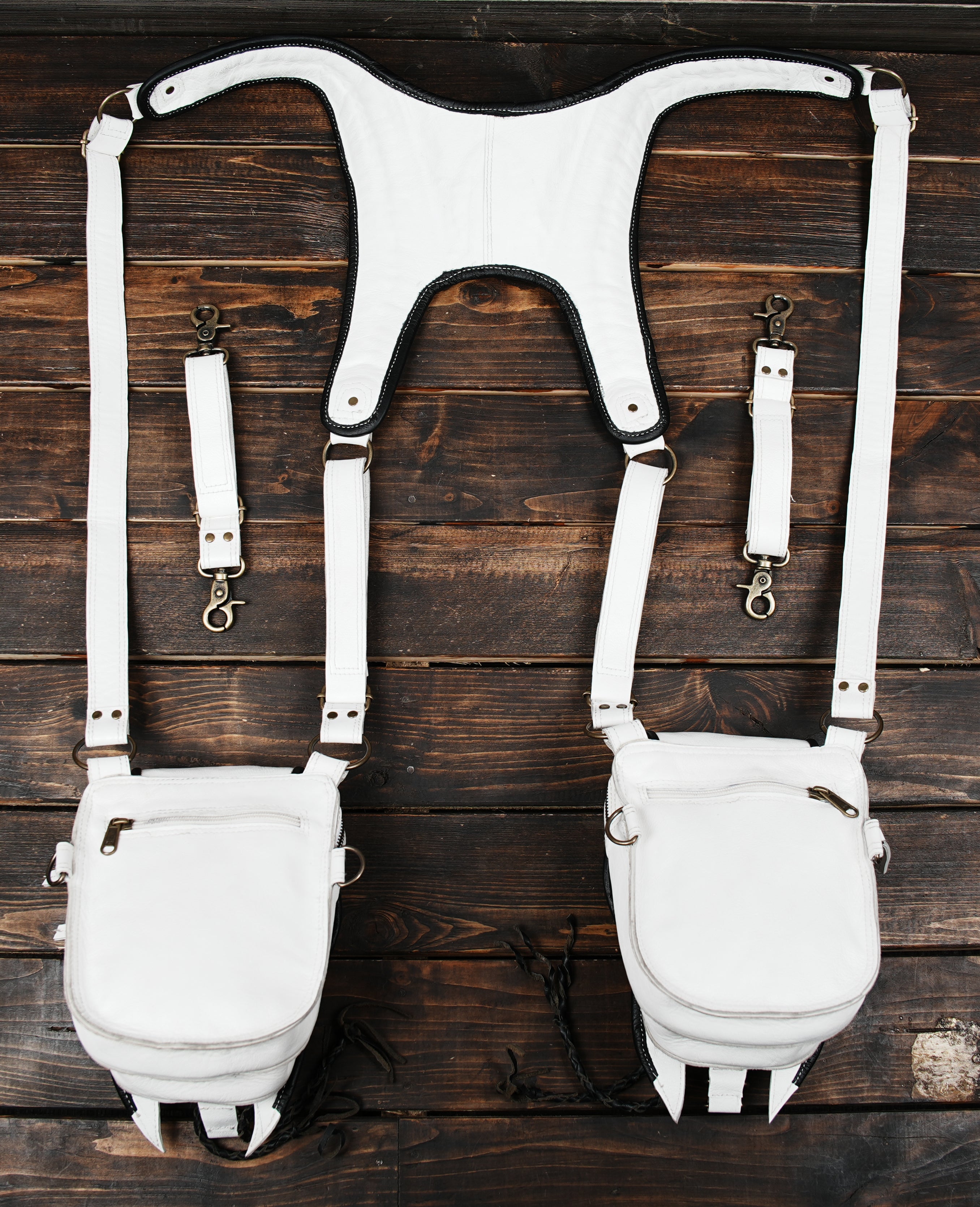 White leather tactical-style holster with gemstone and rivet details