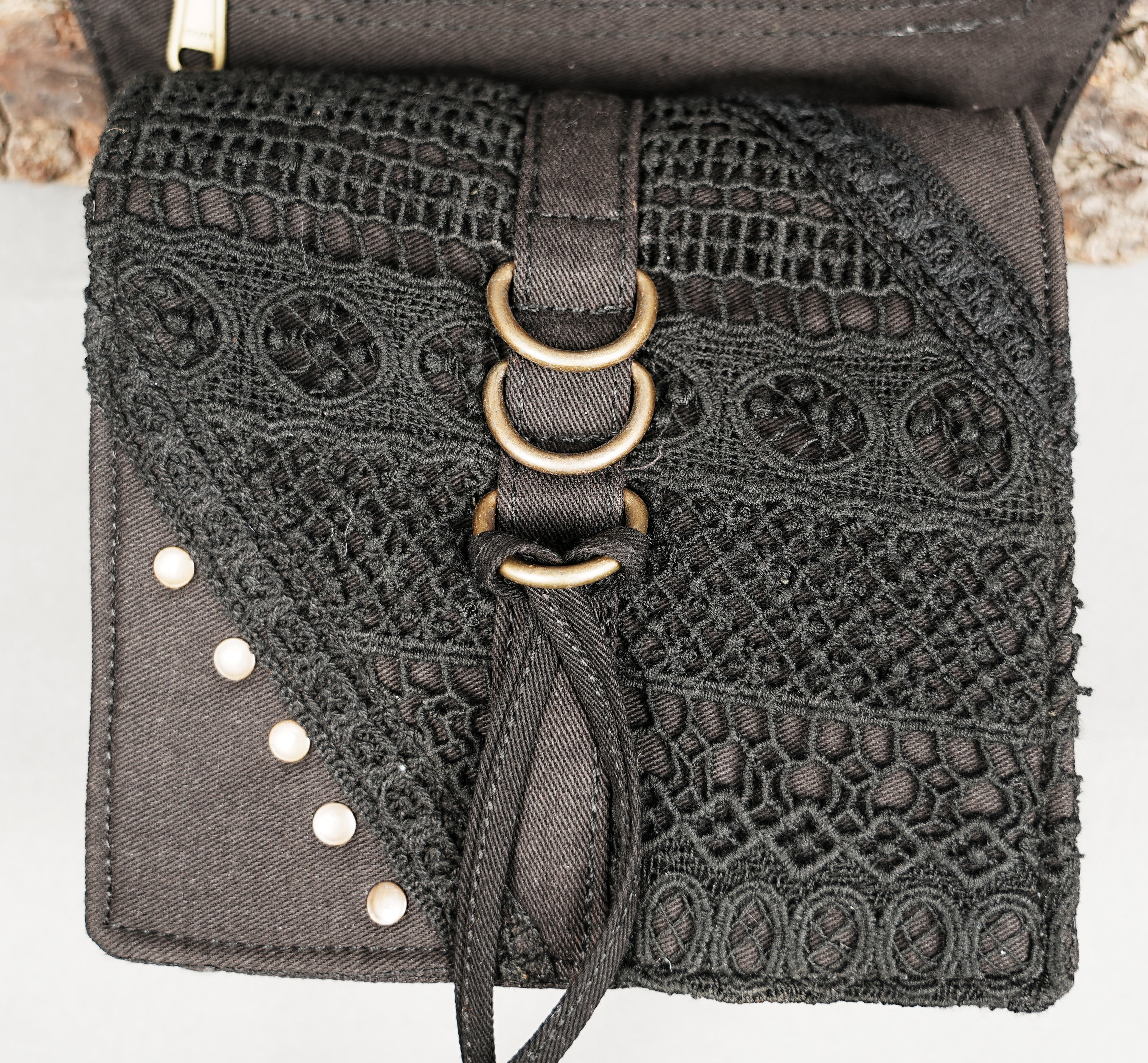 Black tribal print pocket belt with grommet strap