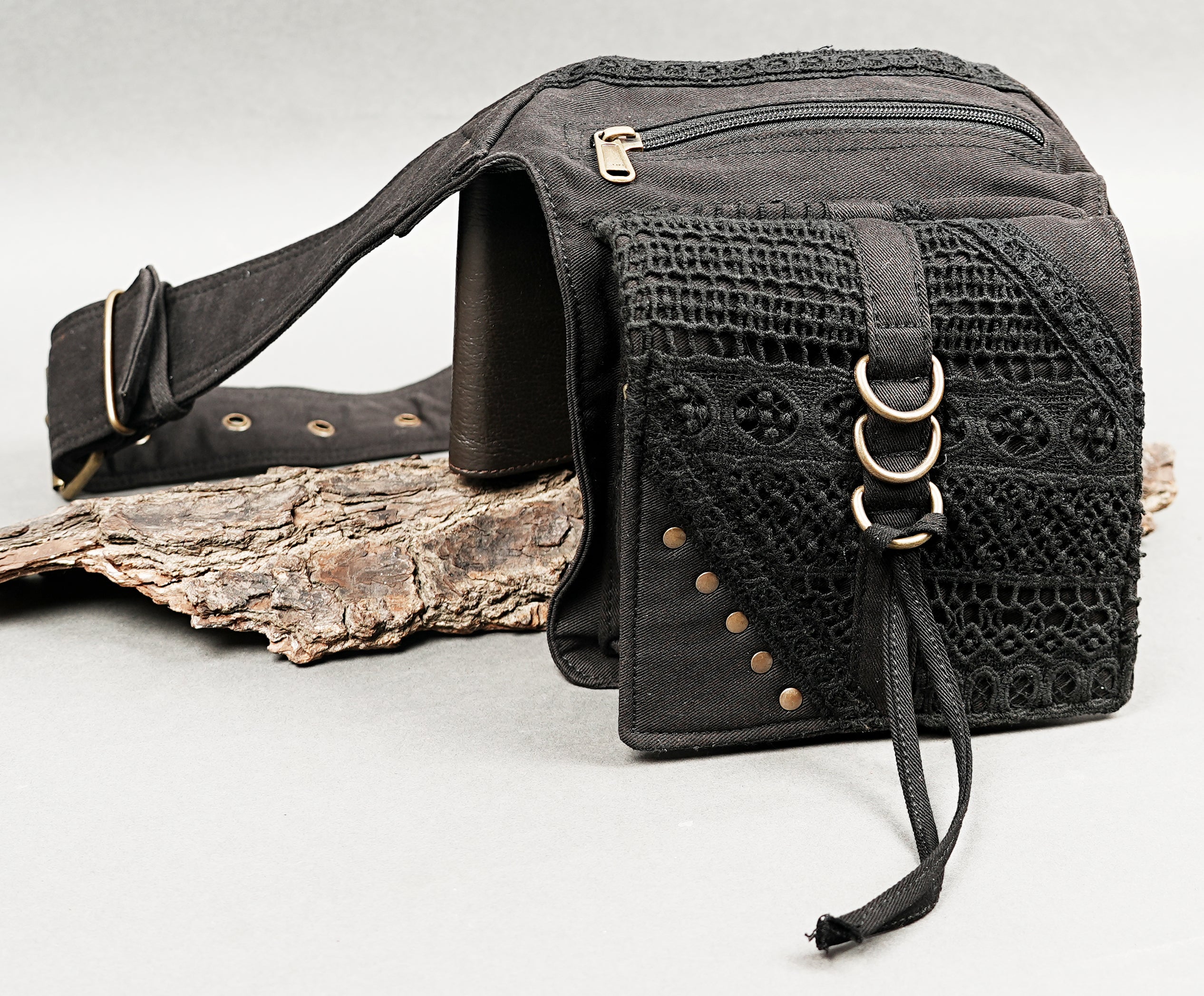 Black hip pouch with embroidered fabric and zip closure