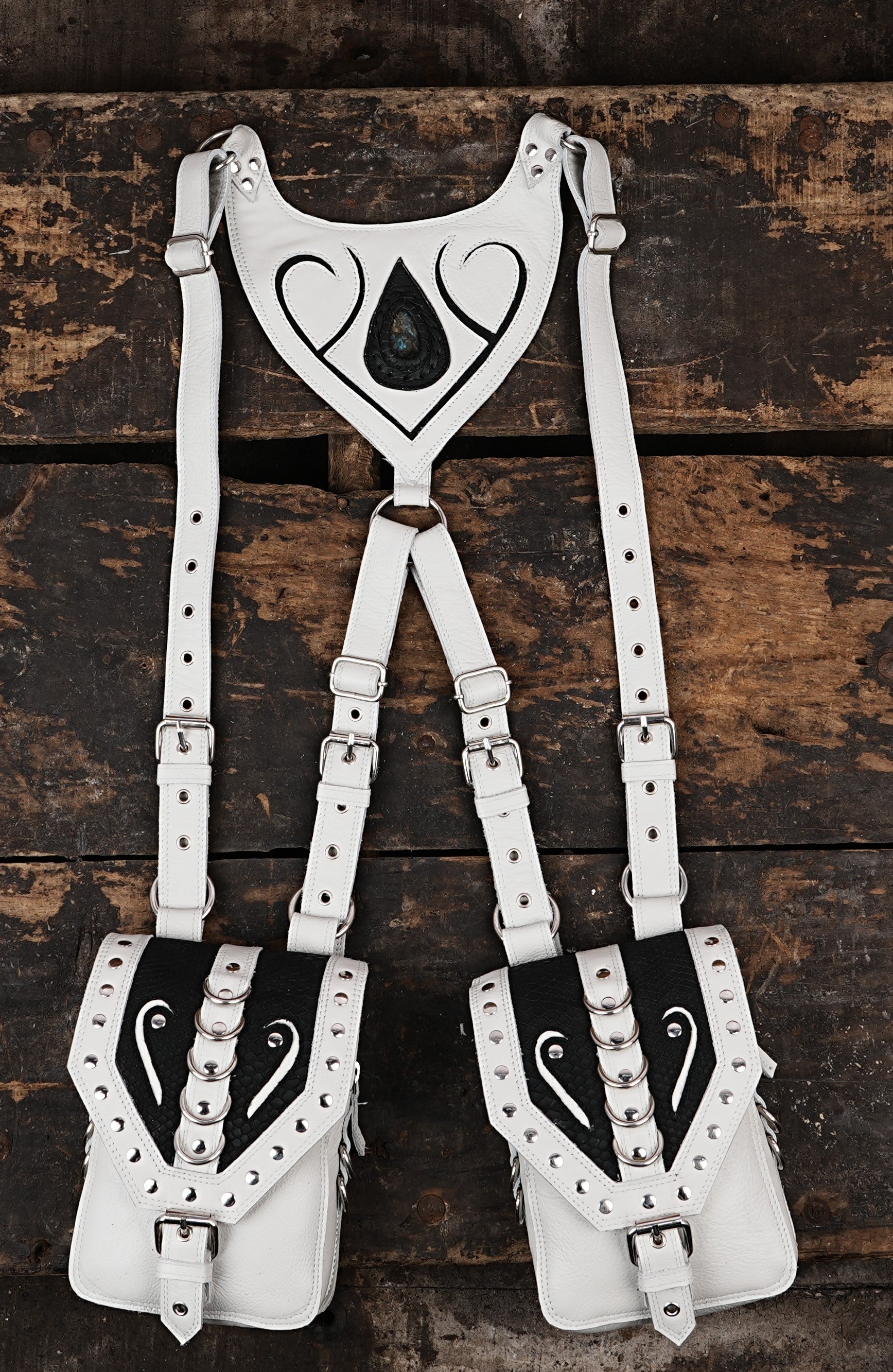 White leather dual holster with black panel and gemstone centerpiece