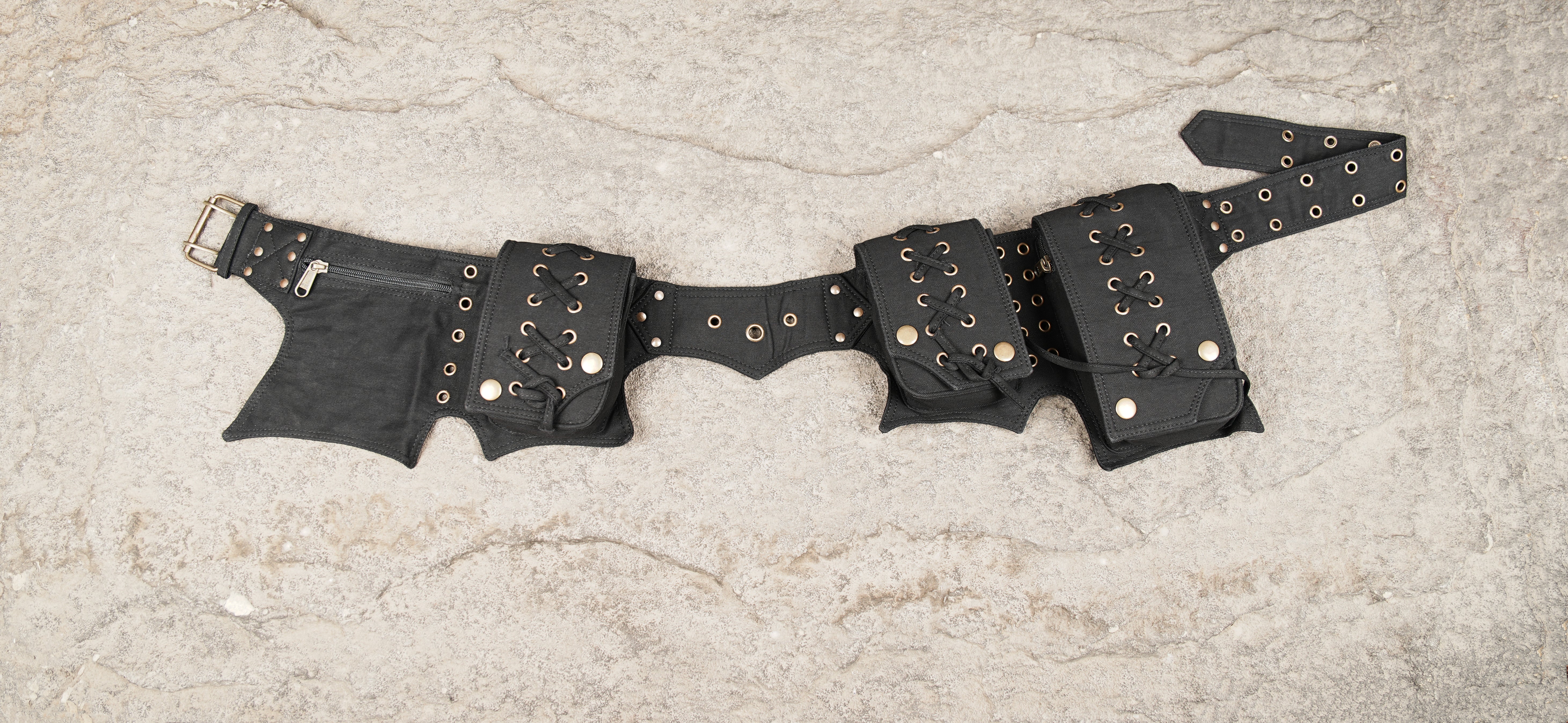 Black cotton utility belt with multiple lace-up pockets and adjustable waist strap
