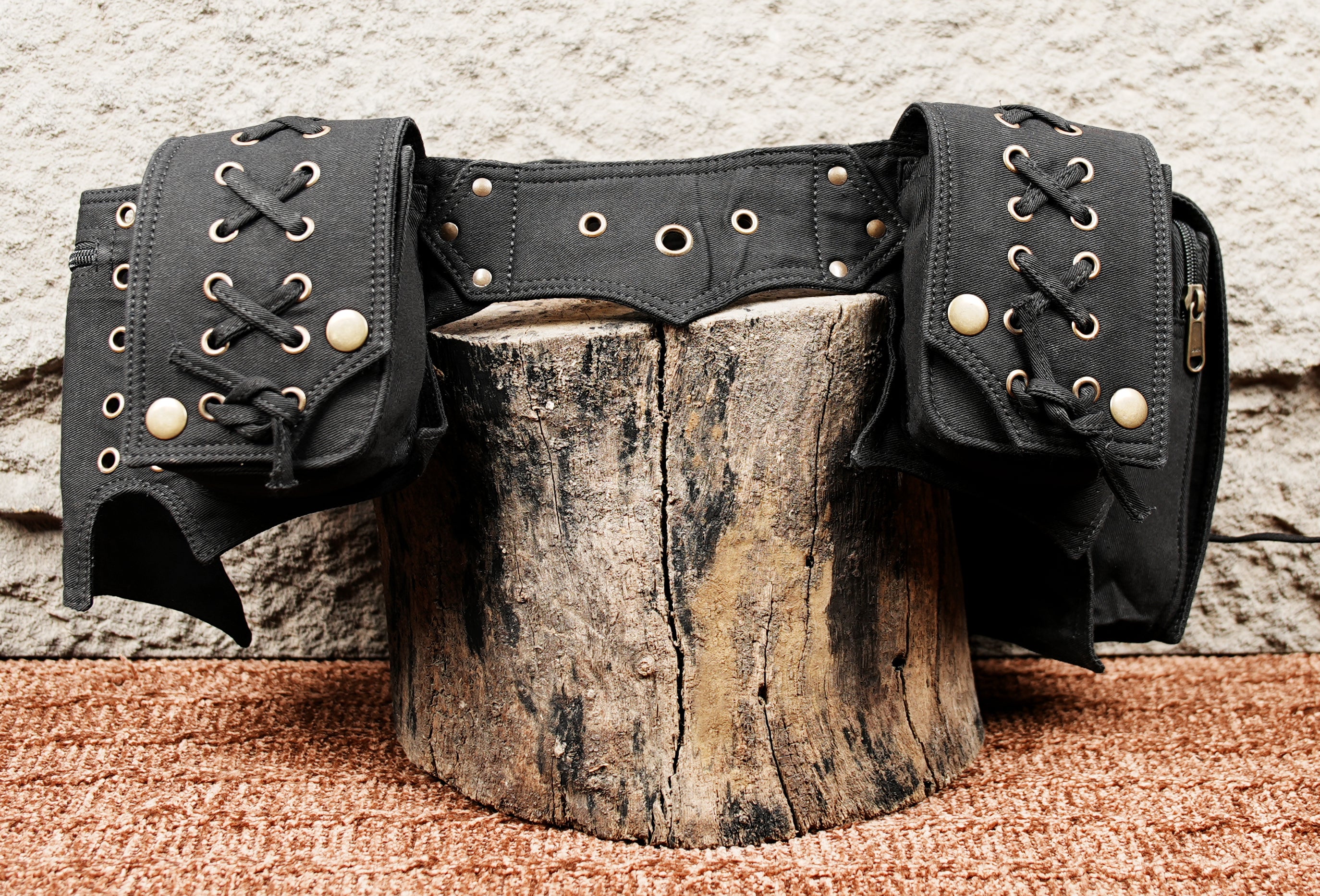 Alternative fashion waist belt with cargo pockets and eyelet detailing