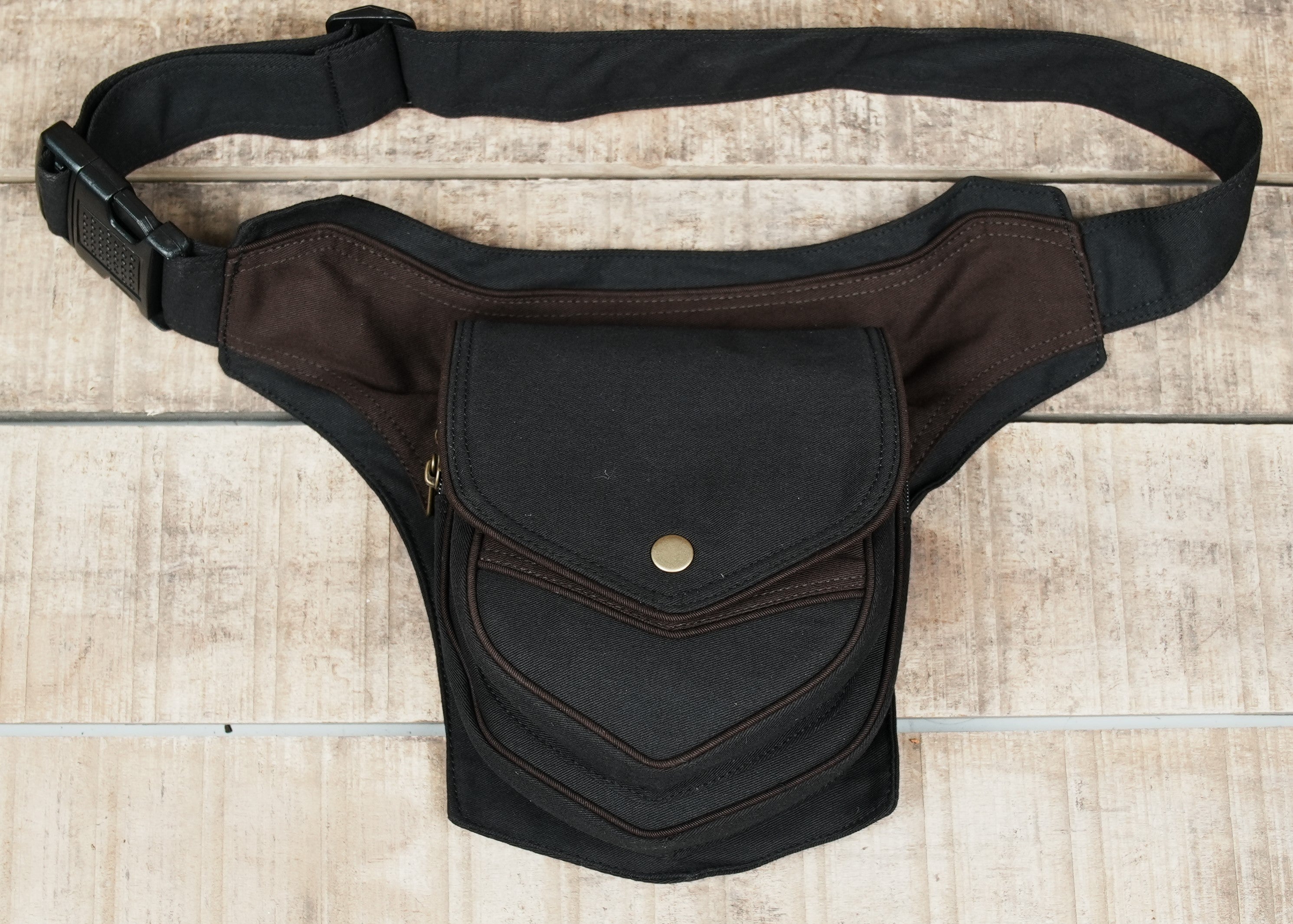 Two-tone black and brown cotton drop-leg utility belt with snap pocket