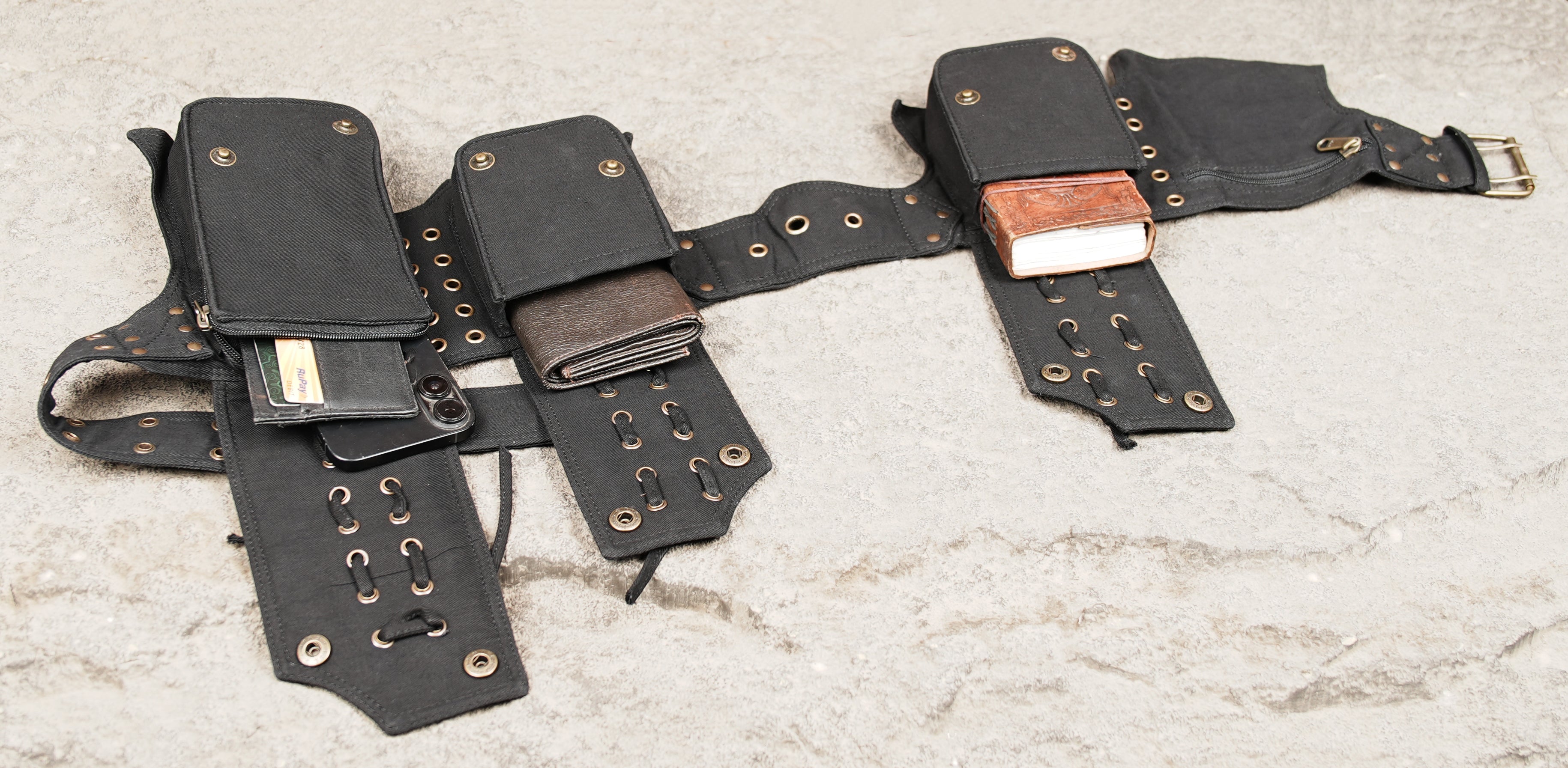 Boho utility belt with black cotton pockets and brass eyelet accents