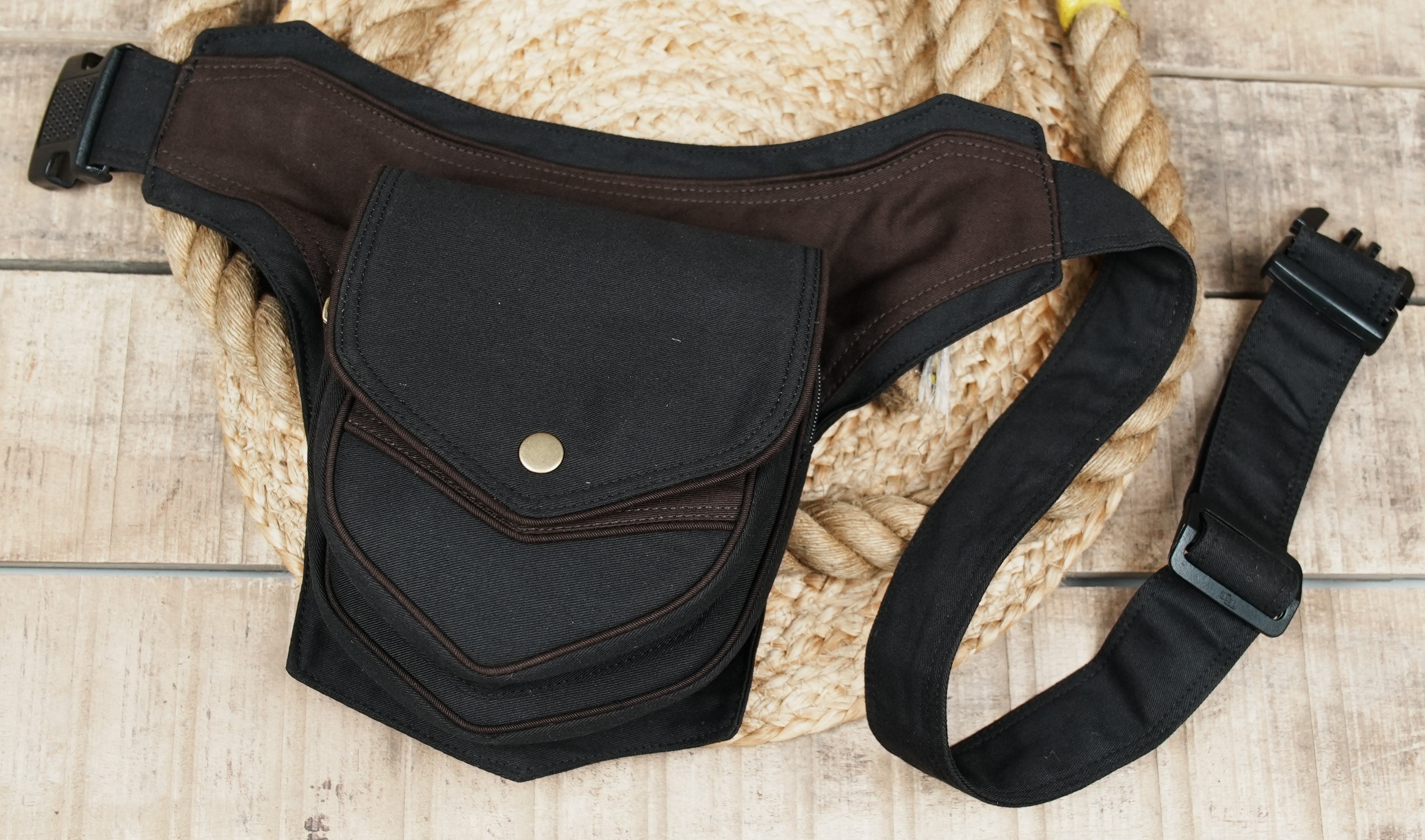 Casual black and brown waist bag with metallic button accent