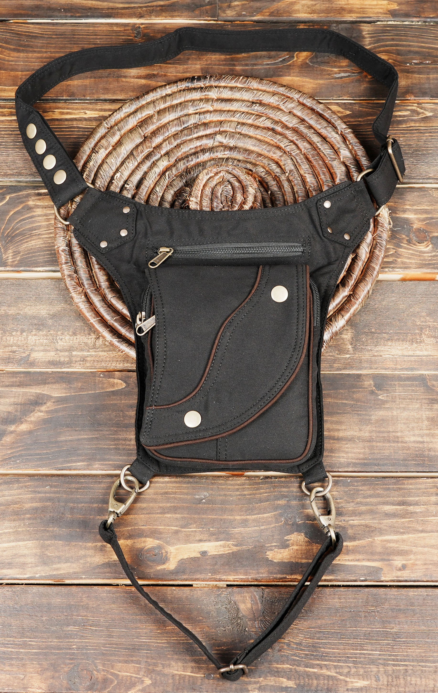 Gothic cyberpunk canvas waist pack with metal snap details and adjustable thigh strap.