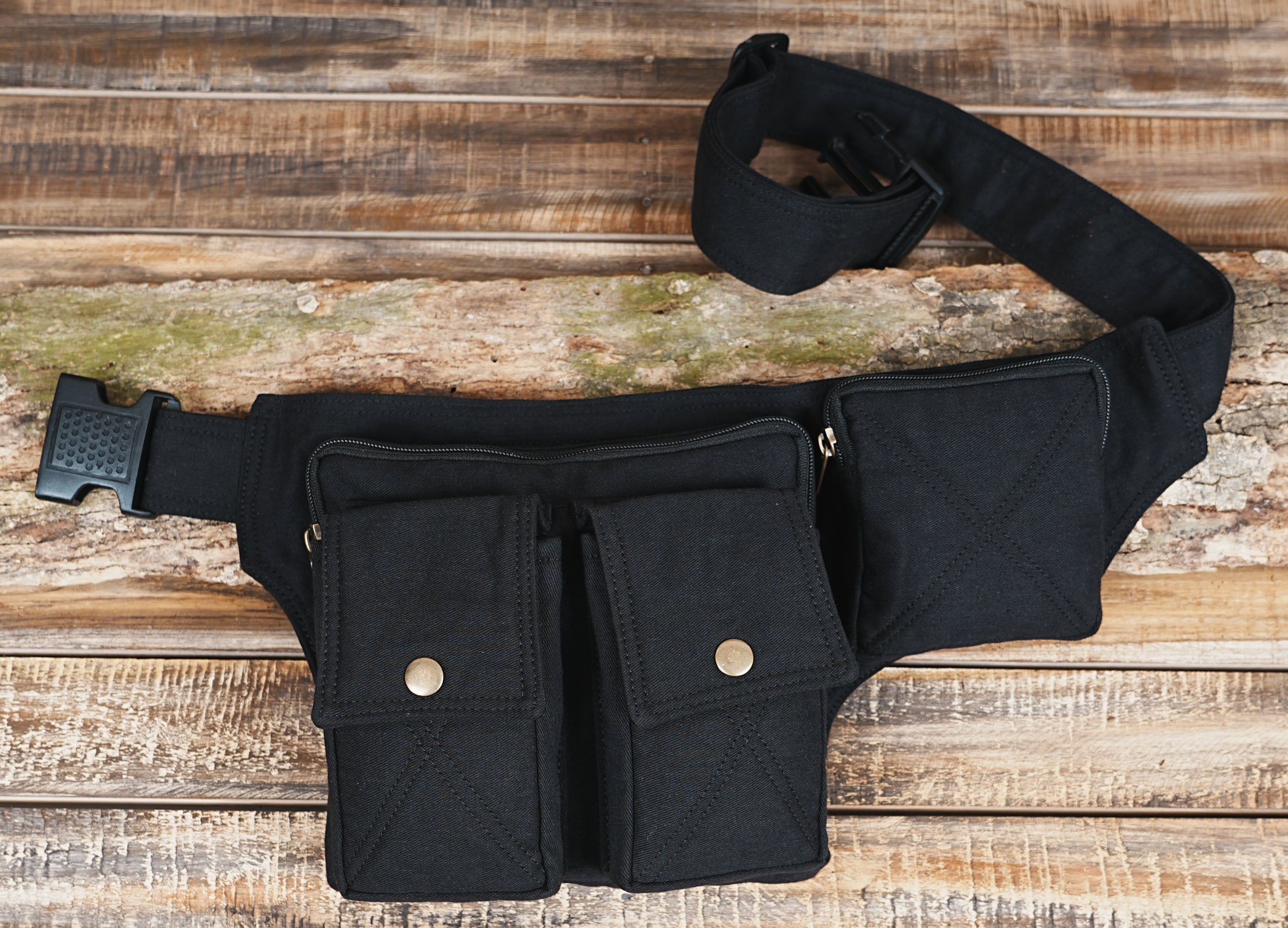 Black utility pouch with zippered front and adjustable canvas strap