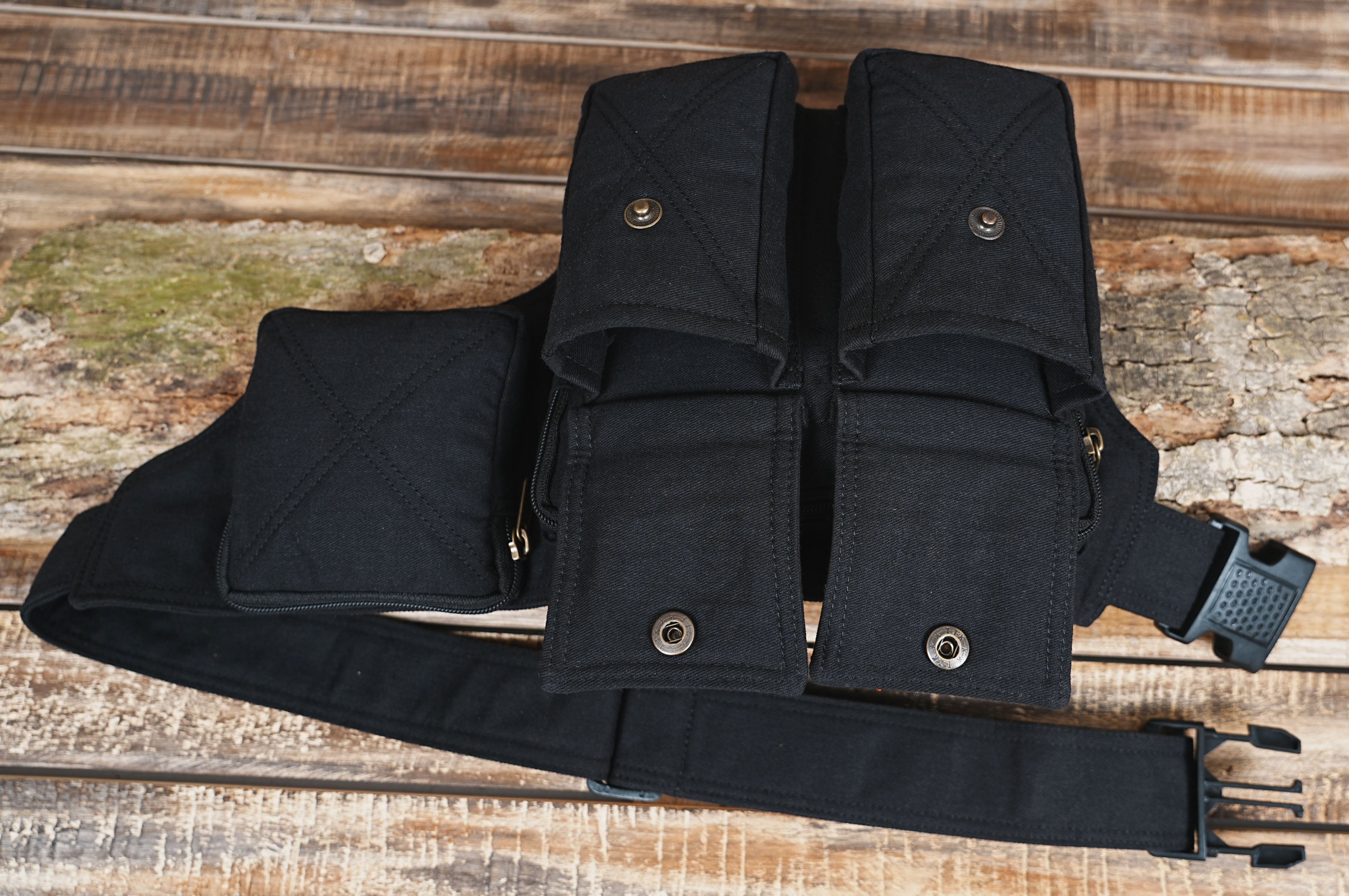 Wide view of tactical utility bag laid on rustic wood surface
