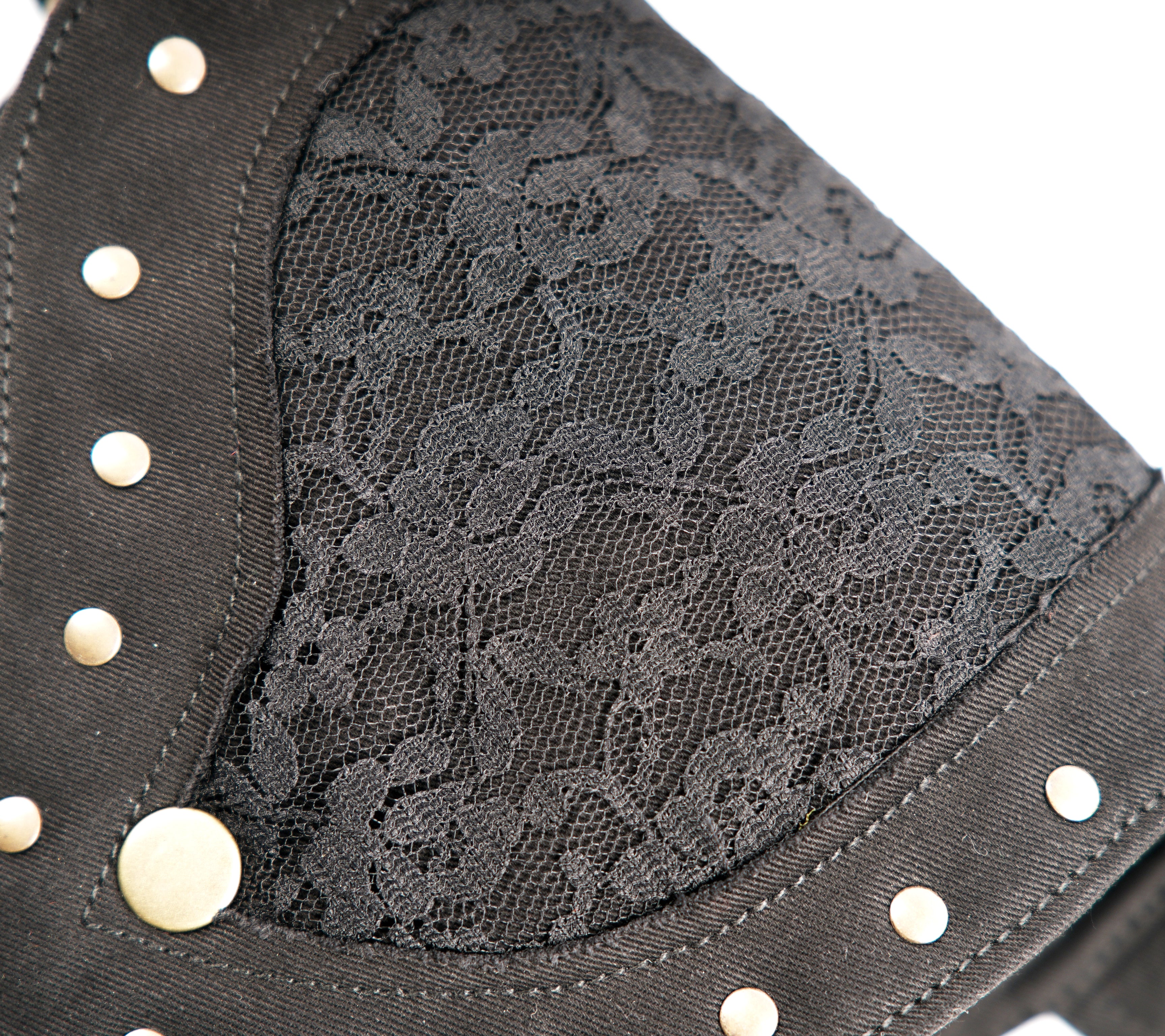 Small, asymmetrical waist pouch with gold ring details and studded flap for hands-free convenience.