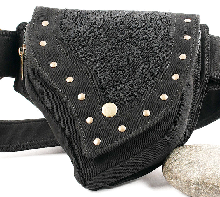 Adjustable canvas bumbag in an asymmetrical pouch design with polished gold-tone hardware accents.