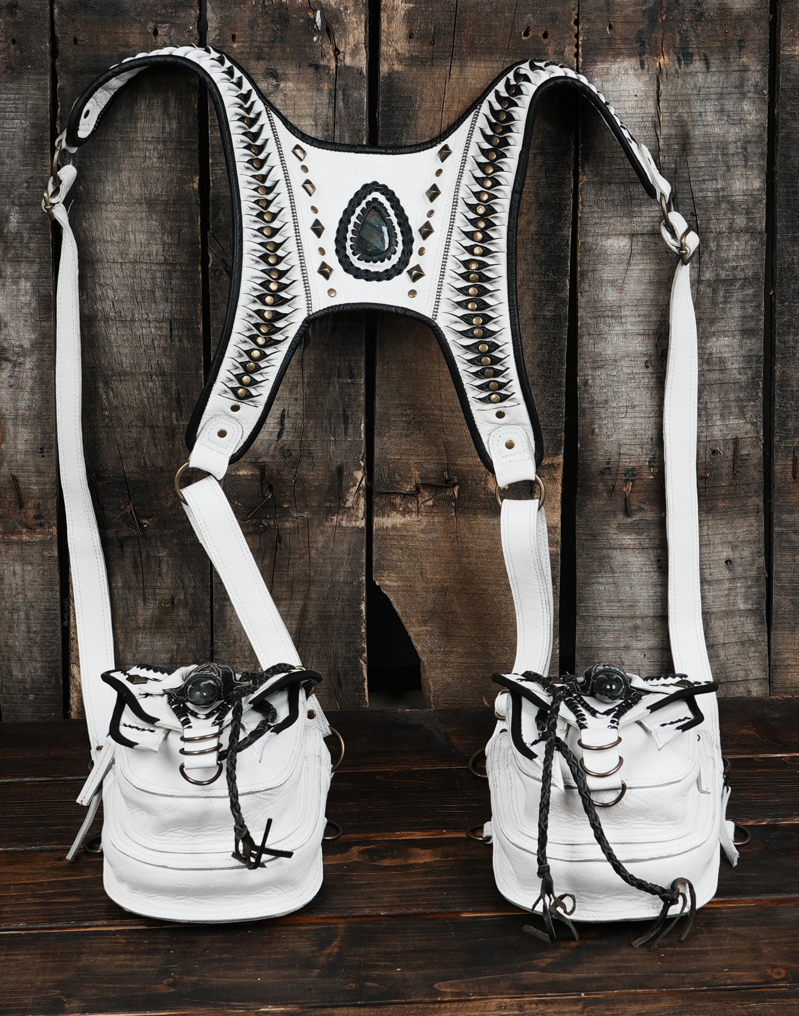 White leather festival holster with braided accents and rivets