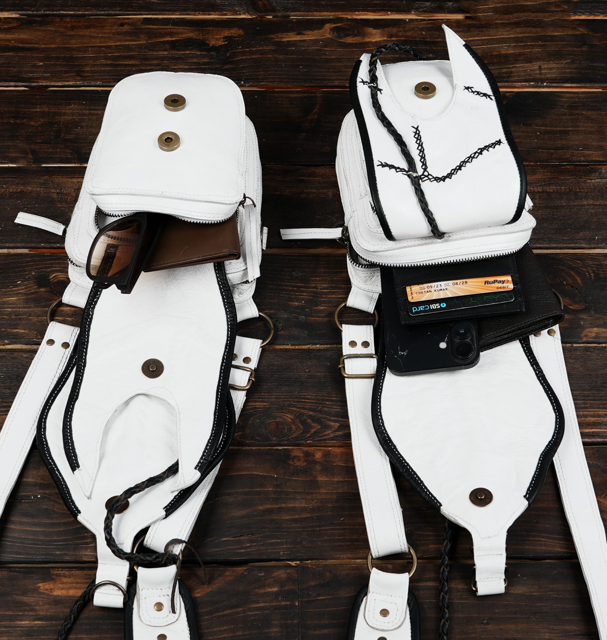Adjustable leather shoulder harness with two detailed holster bags