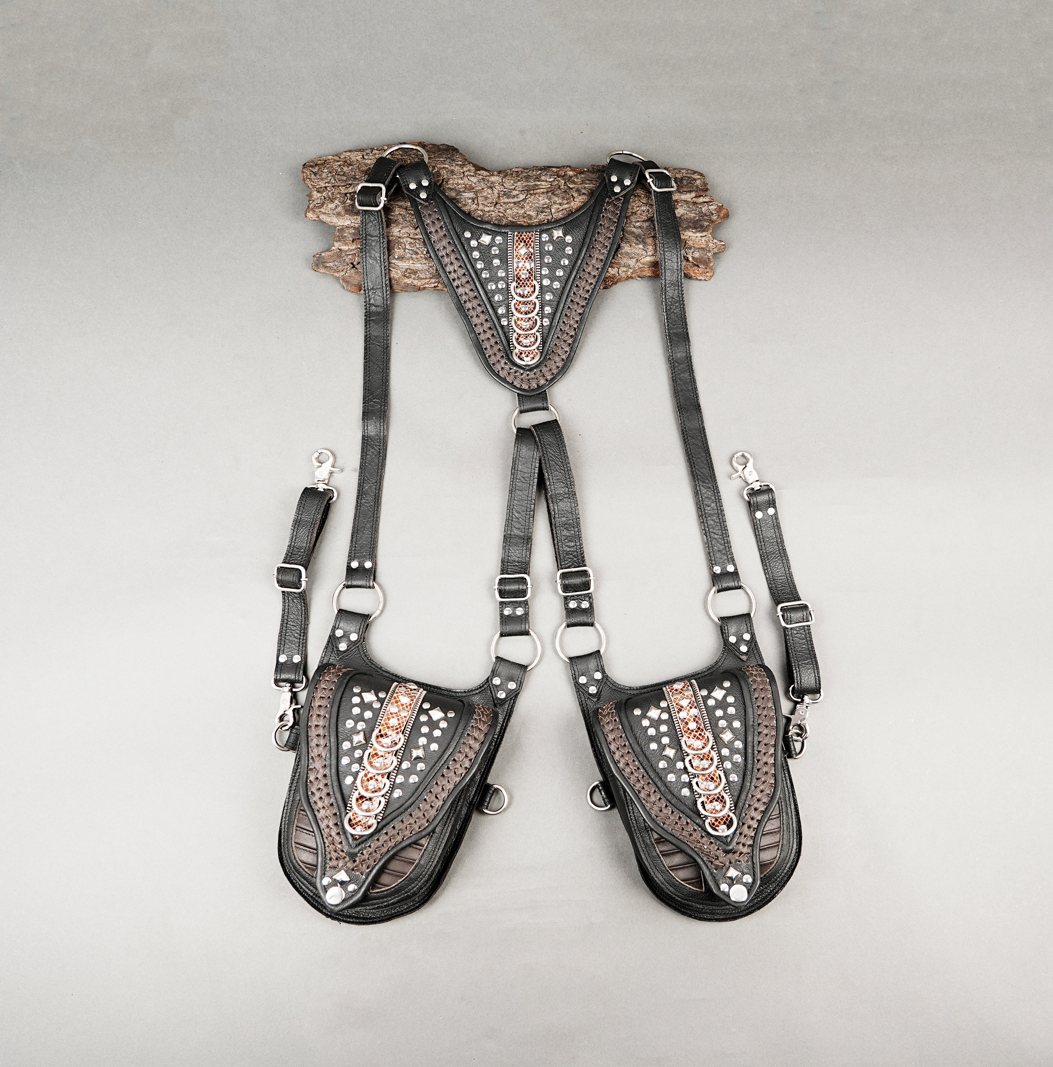 Black and brown leather dual shoulder holster with decorative copper accents