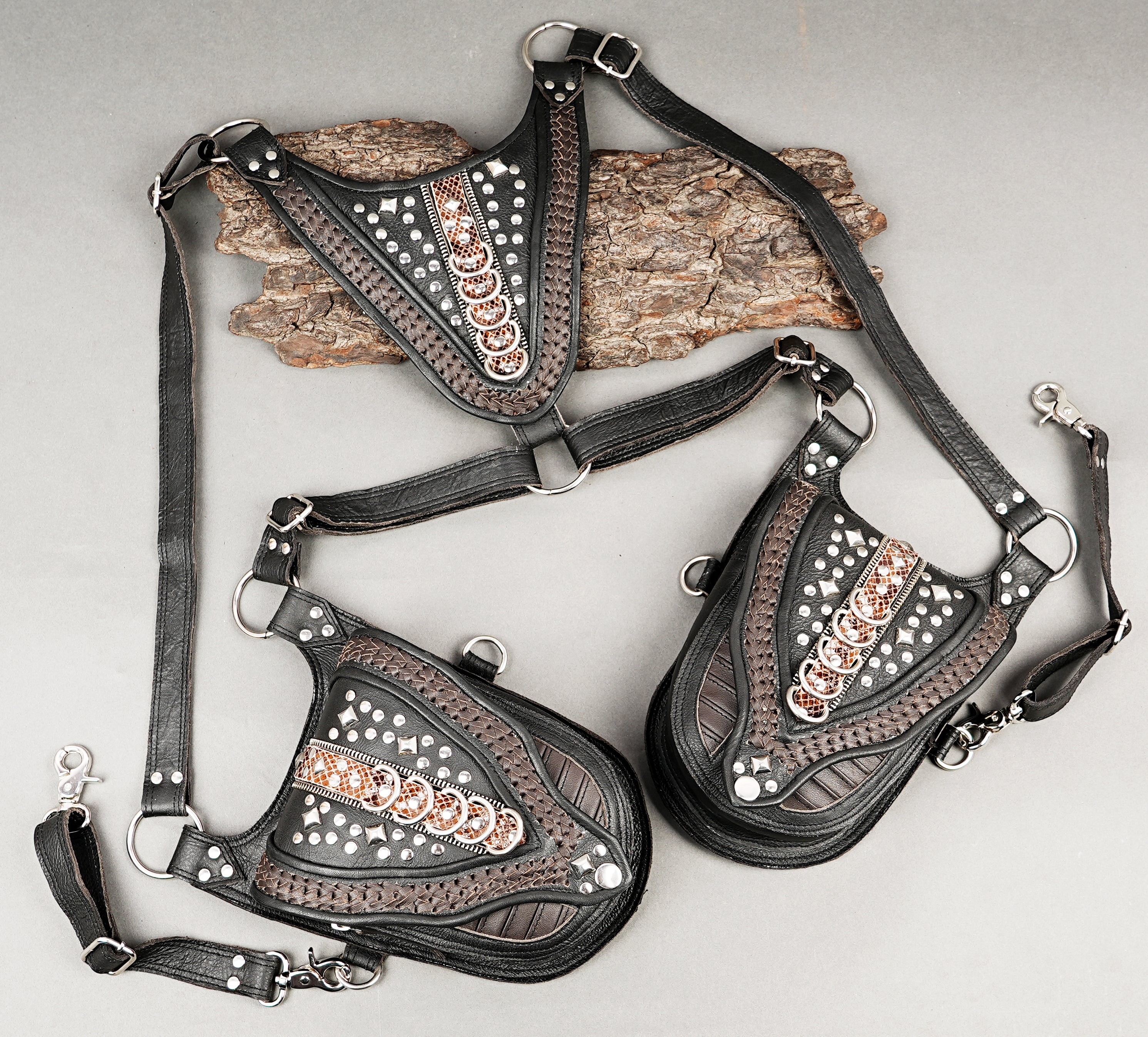 Black leather harness holster with intricate copper embellishments