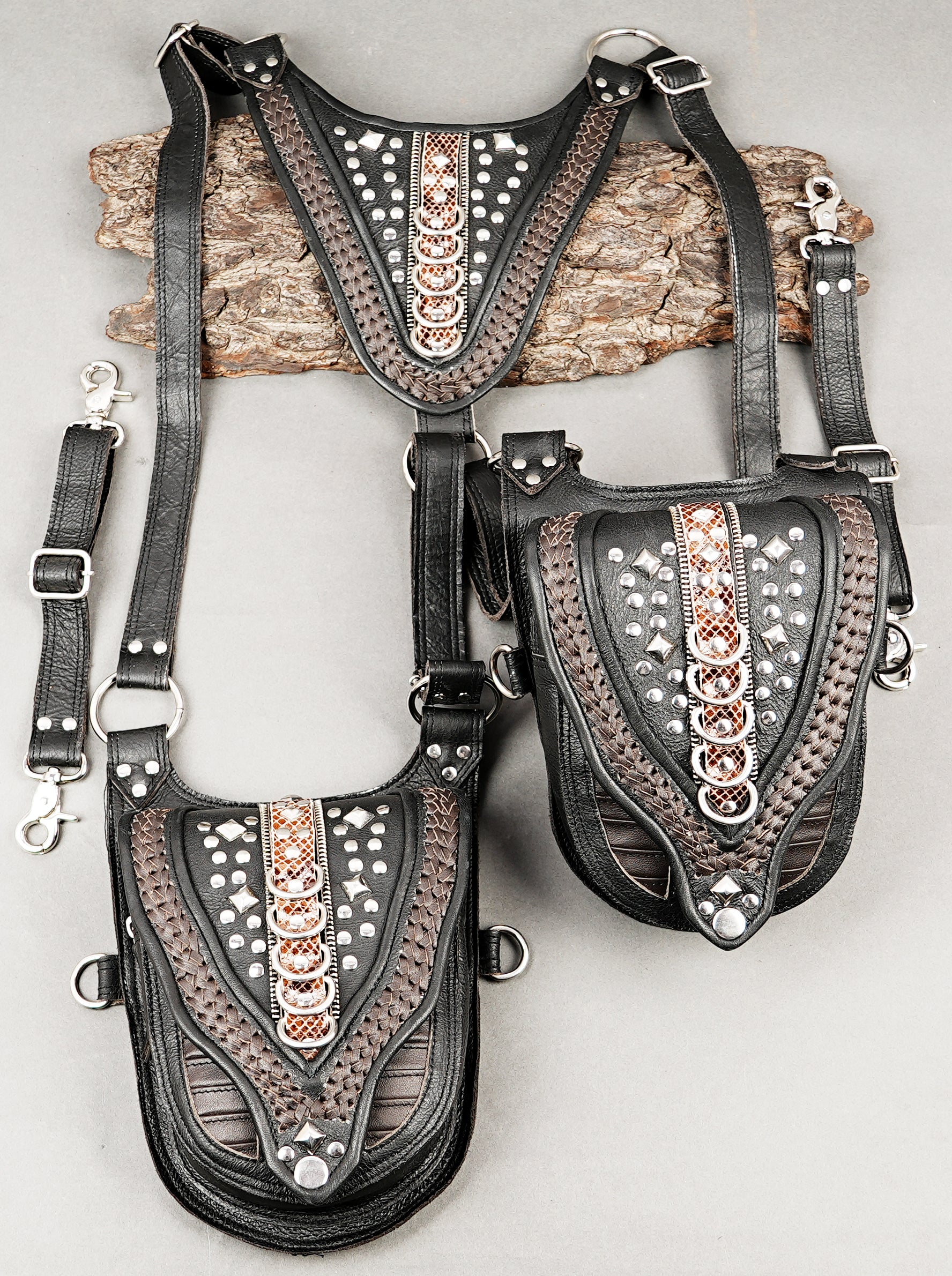 Two-pocket leather holster with engraved accents and metal hardware