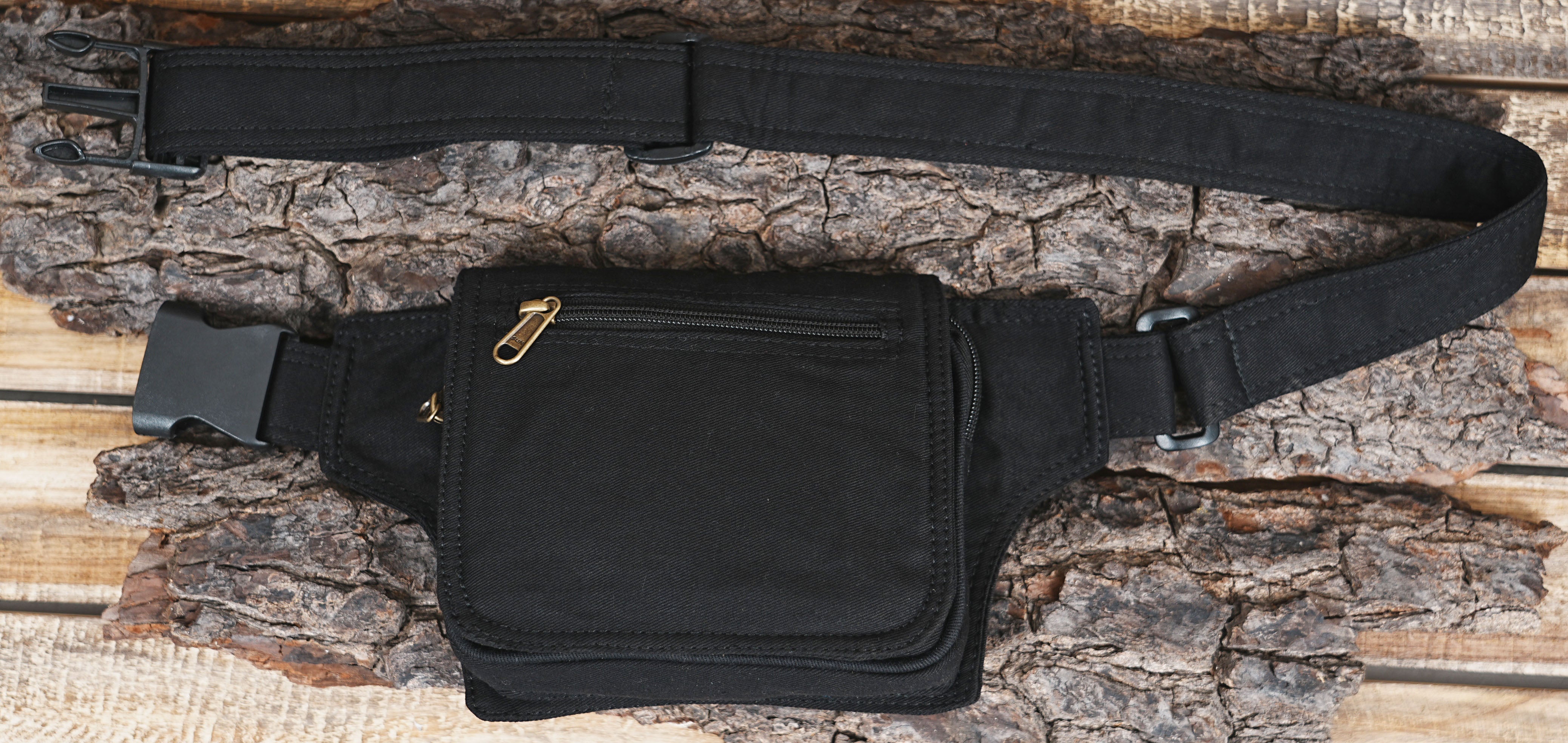 Rugged black multi-purpose pouch belt suitable for travel and hiking.