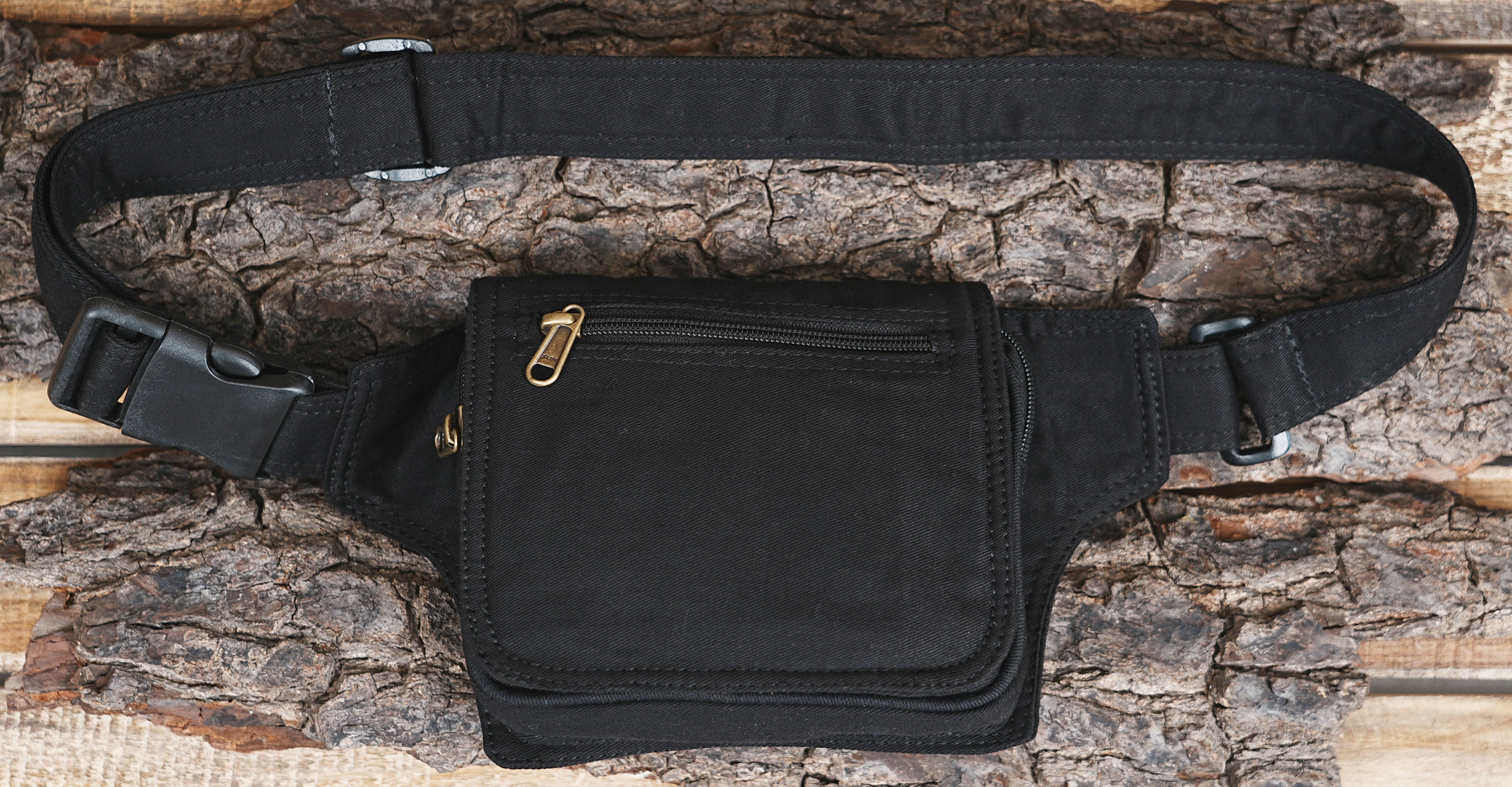 Black canvas utility belt with a zippered front pocket and quick-release buckle.