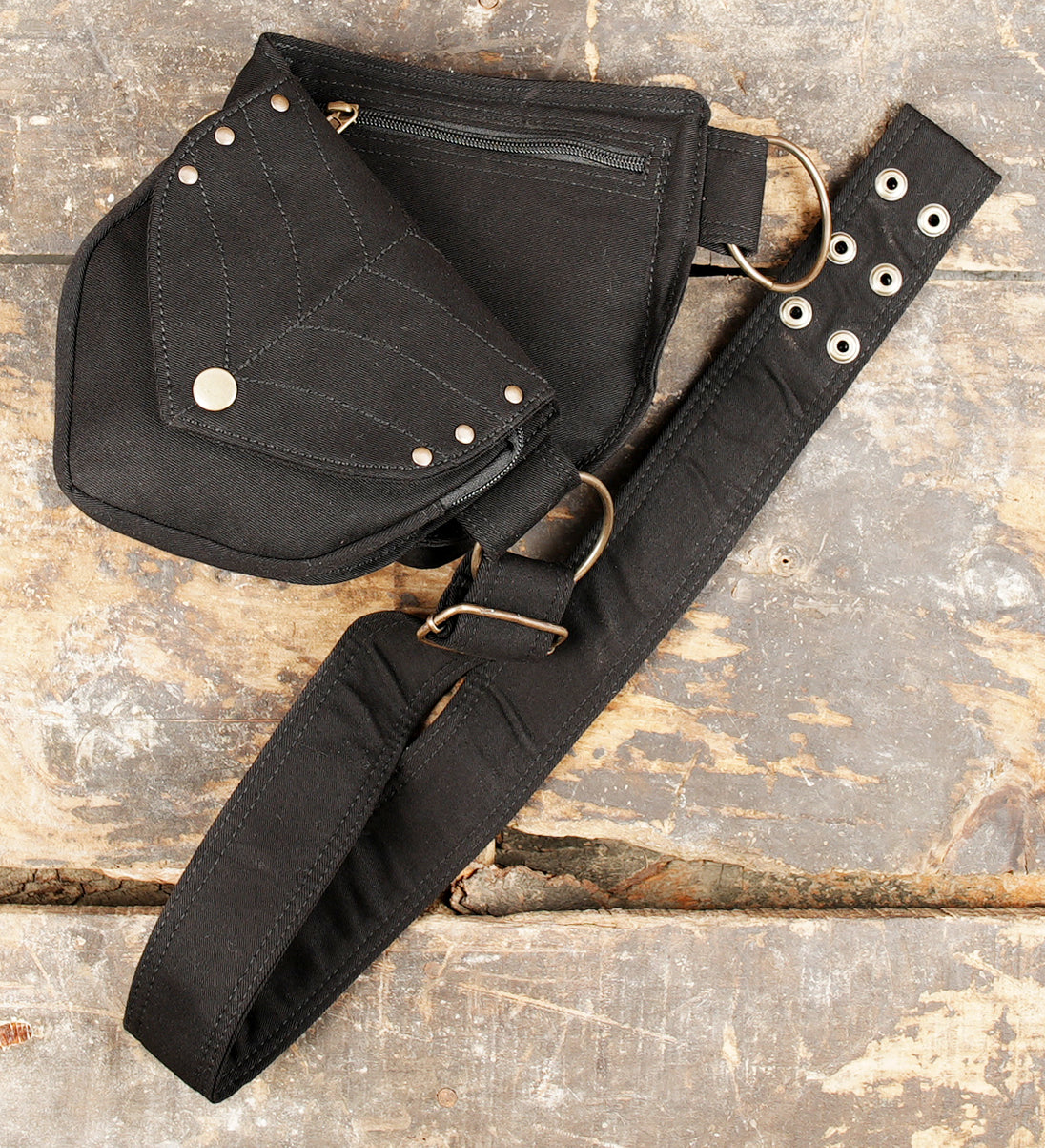 Black cotton hip bag featuring asymmetrical leaf pockets