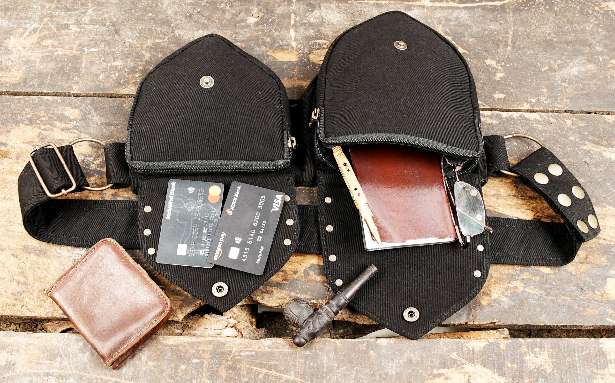 Black canvas waist pack with secure double pocket compartments