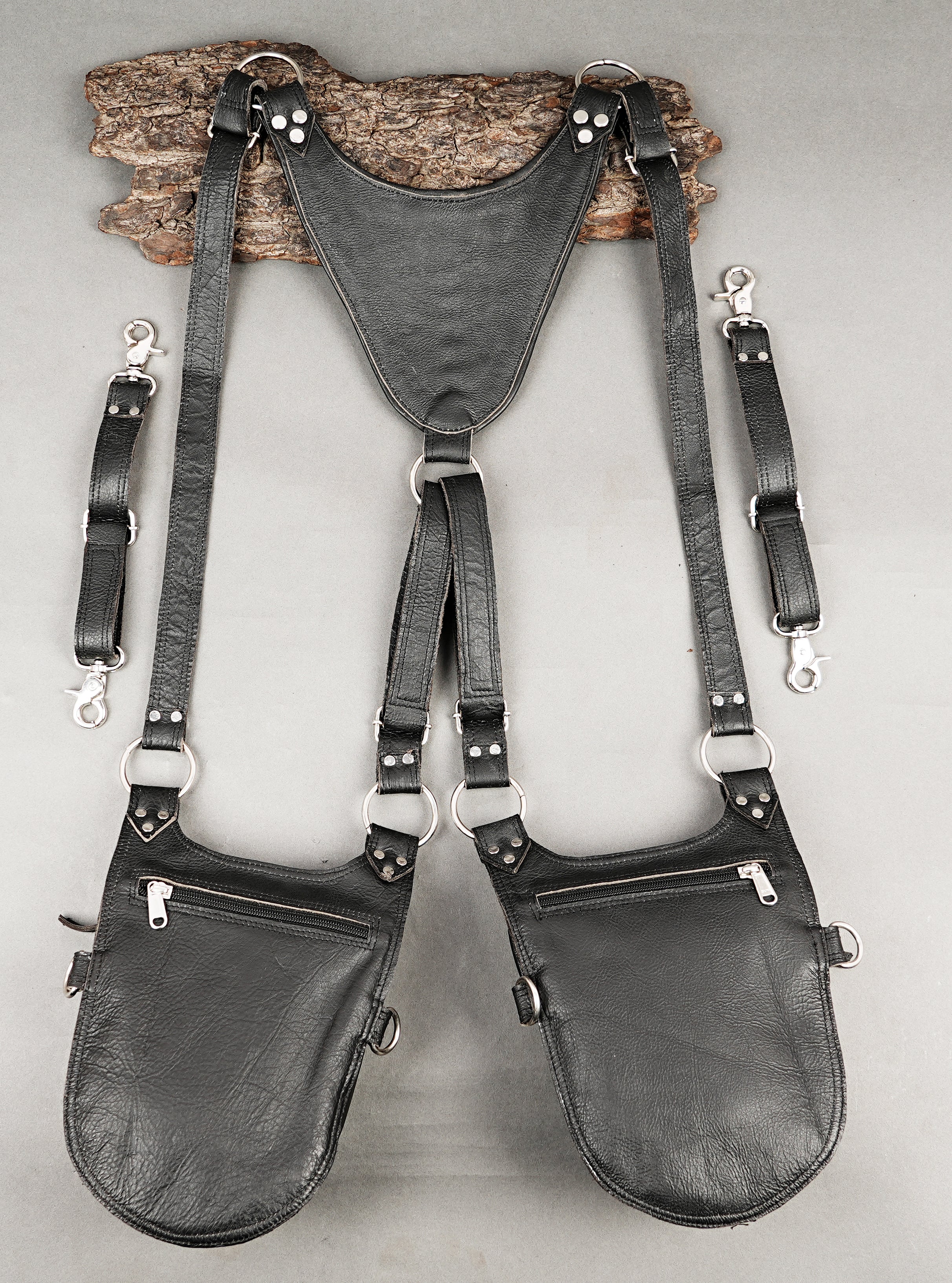 Black dual holster with brown inlays and copper-tone studs