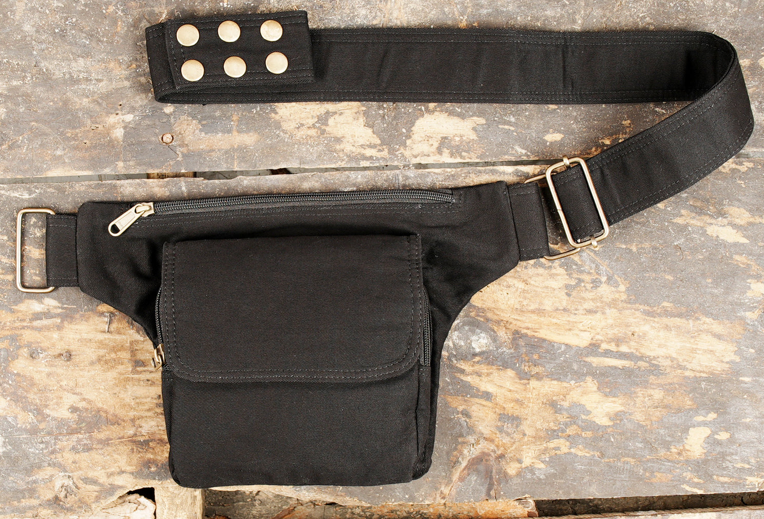 Black cotton canvas waist bag with adjustable strap and brass hardware