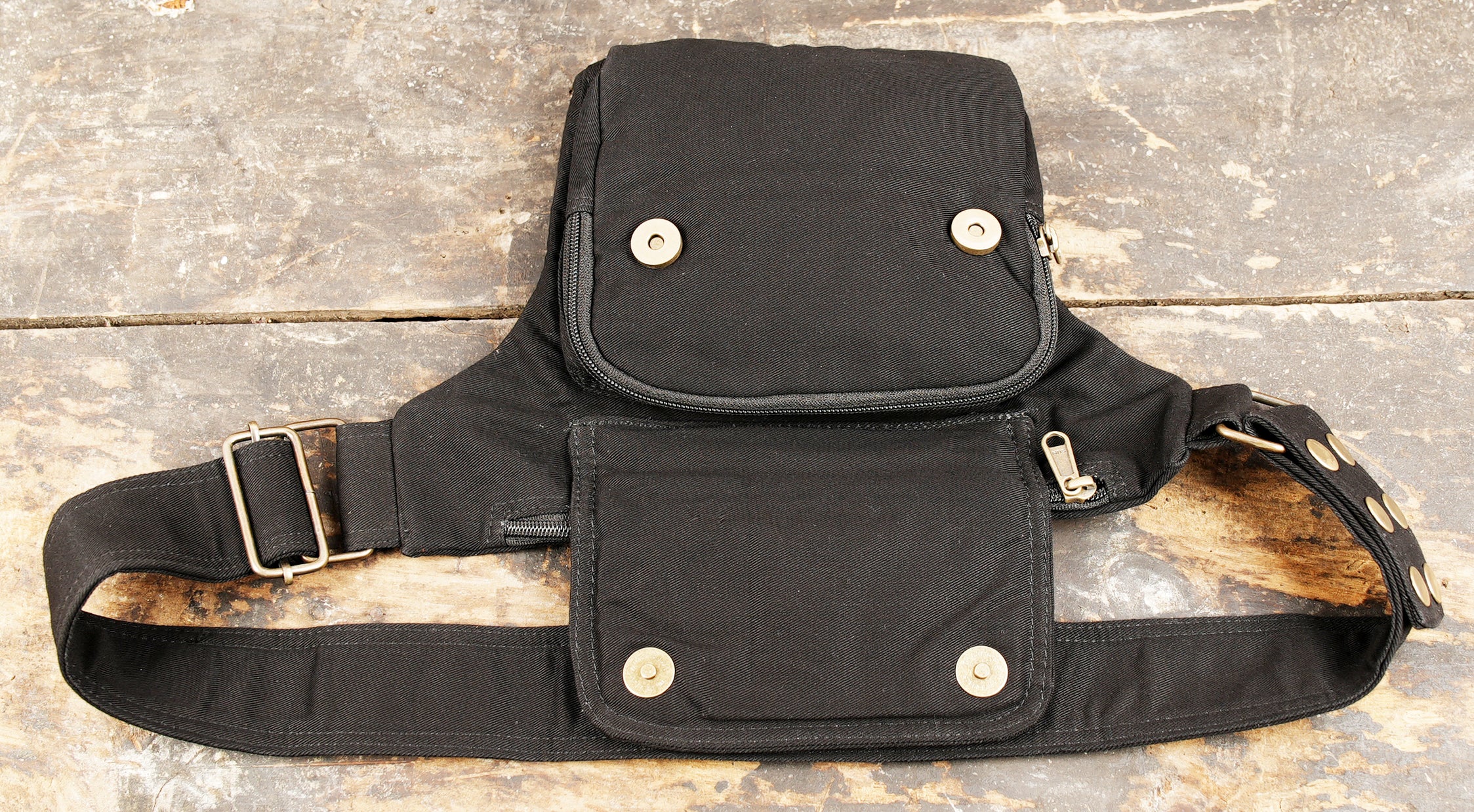 Black utility fanny pack with flap pocket detail