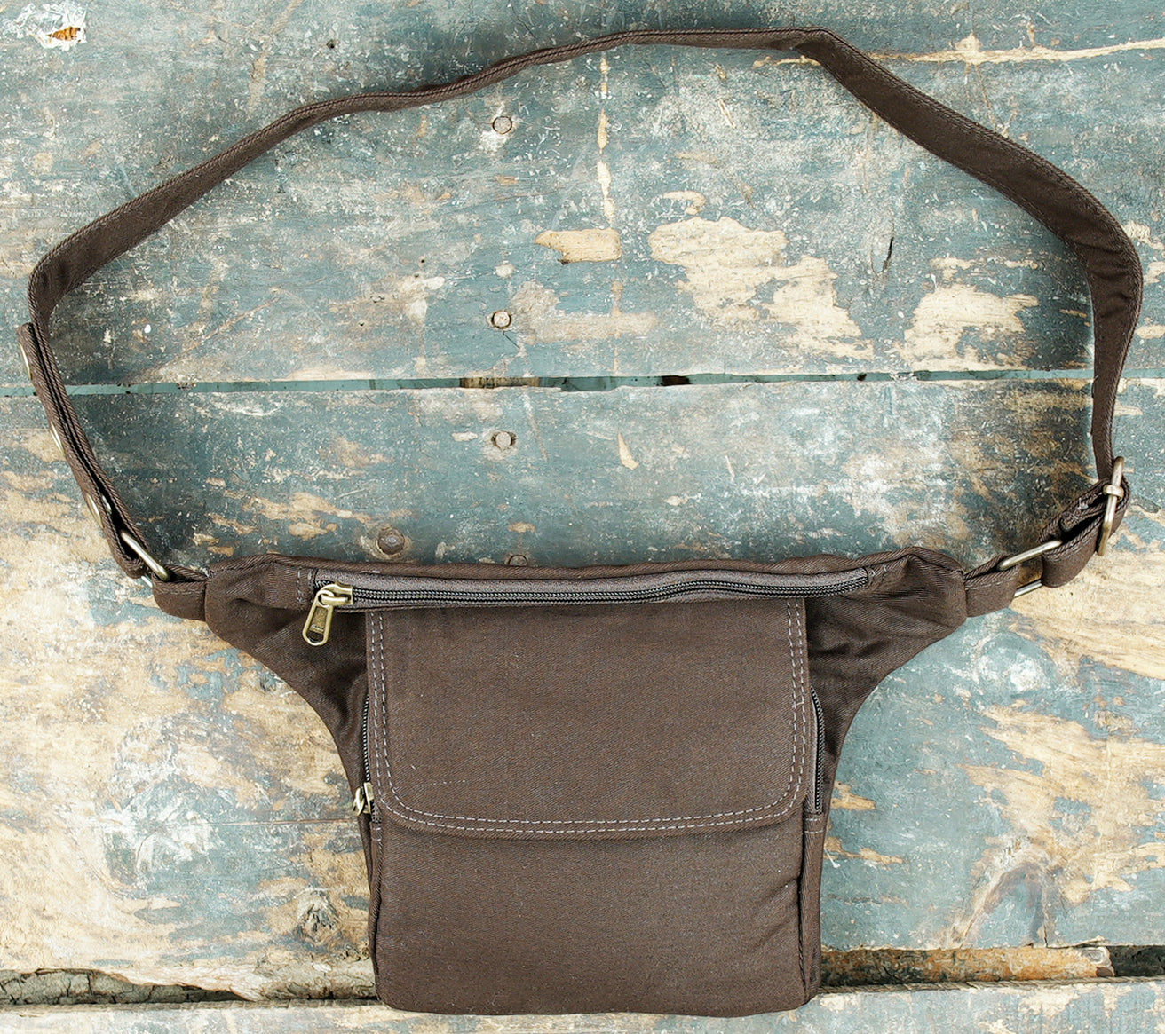 Black canvas waist pack with secure storage compartments