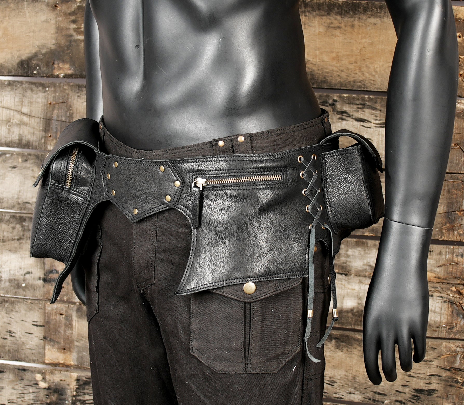 Handmade leather hip pouch with durable stitching and metal details
