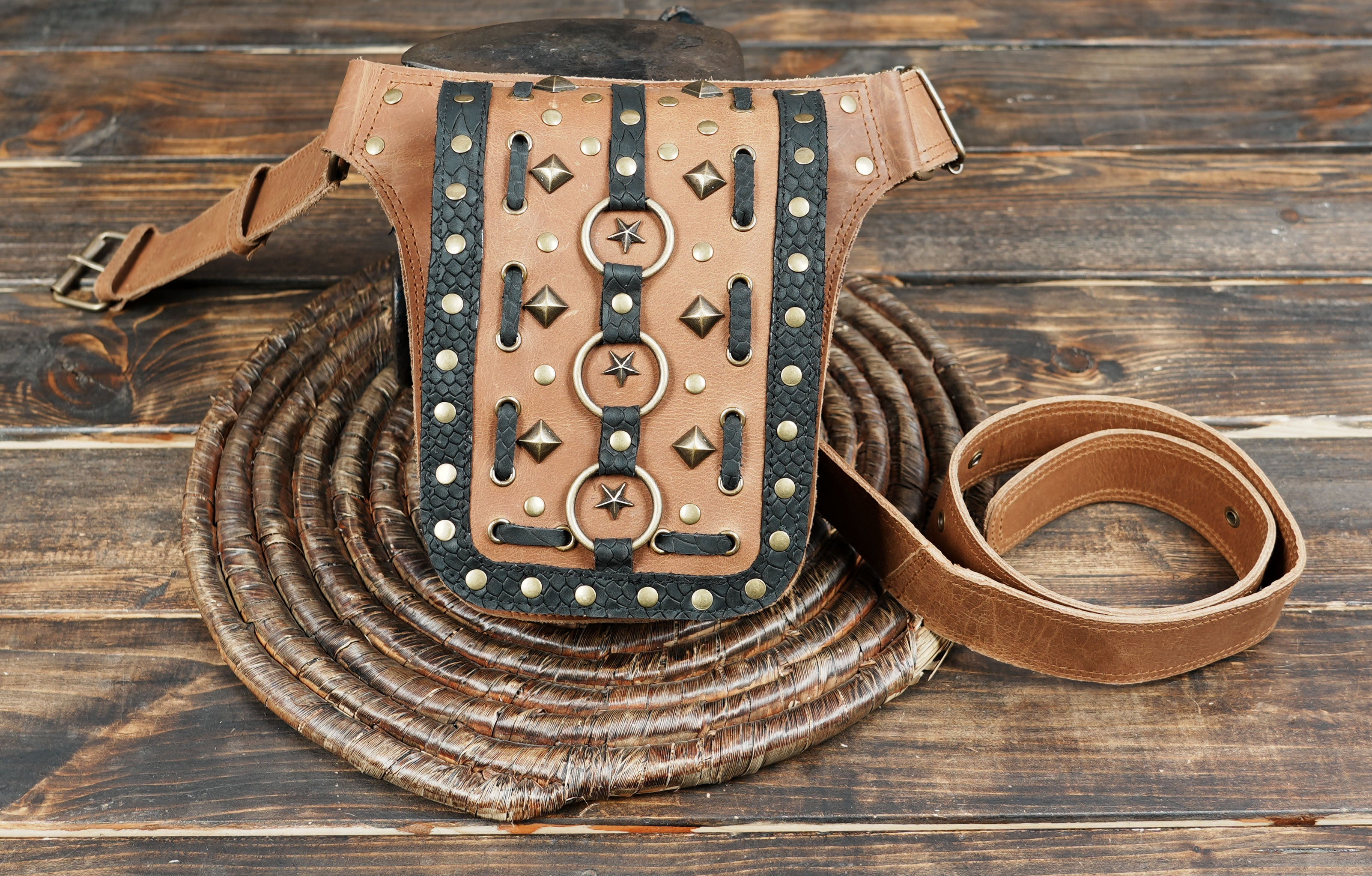 Leather style brown belt with rustic charm and metal accents.