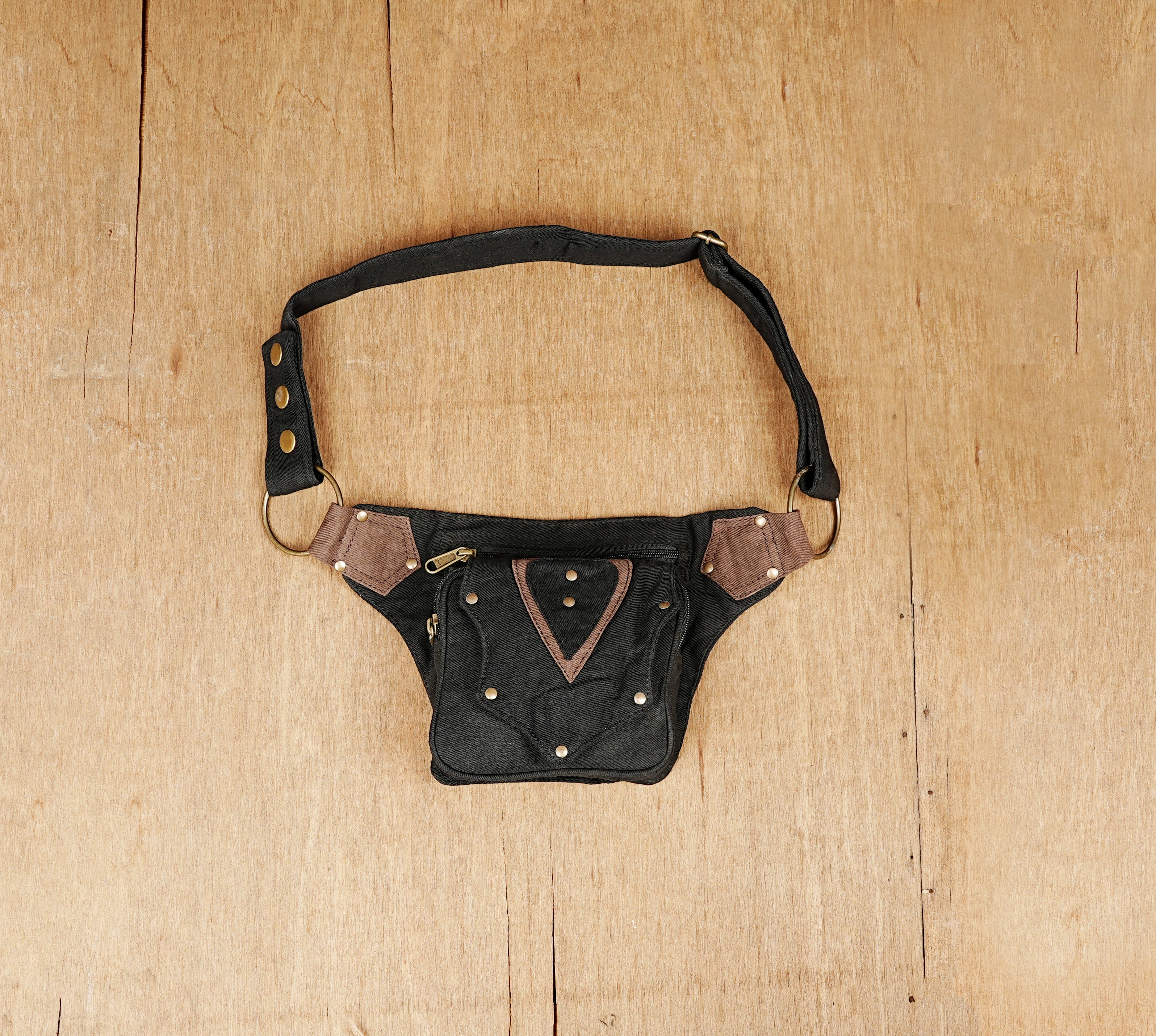 Stylish bumbag for urban adventures, made of heavy-duty black cotton with a reinforced strap.