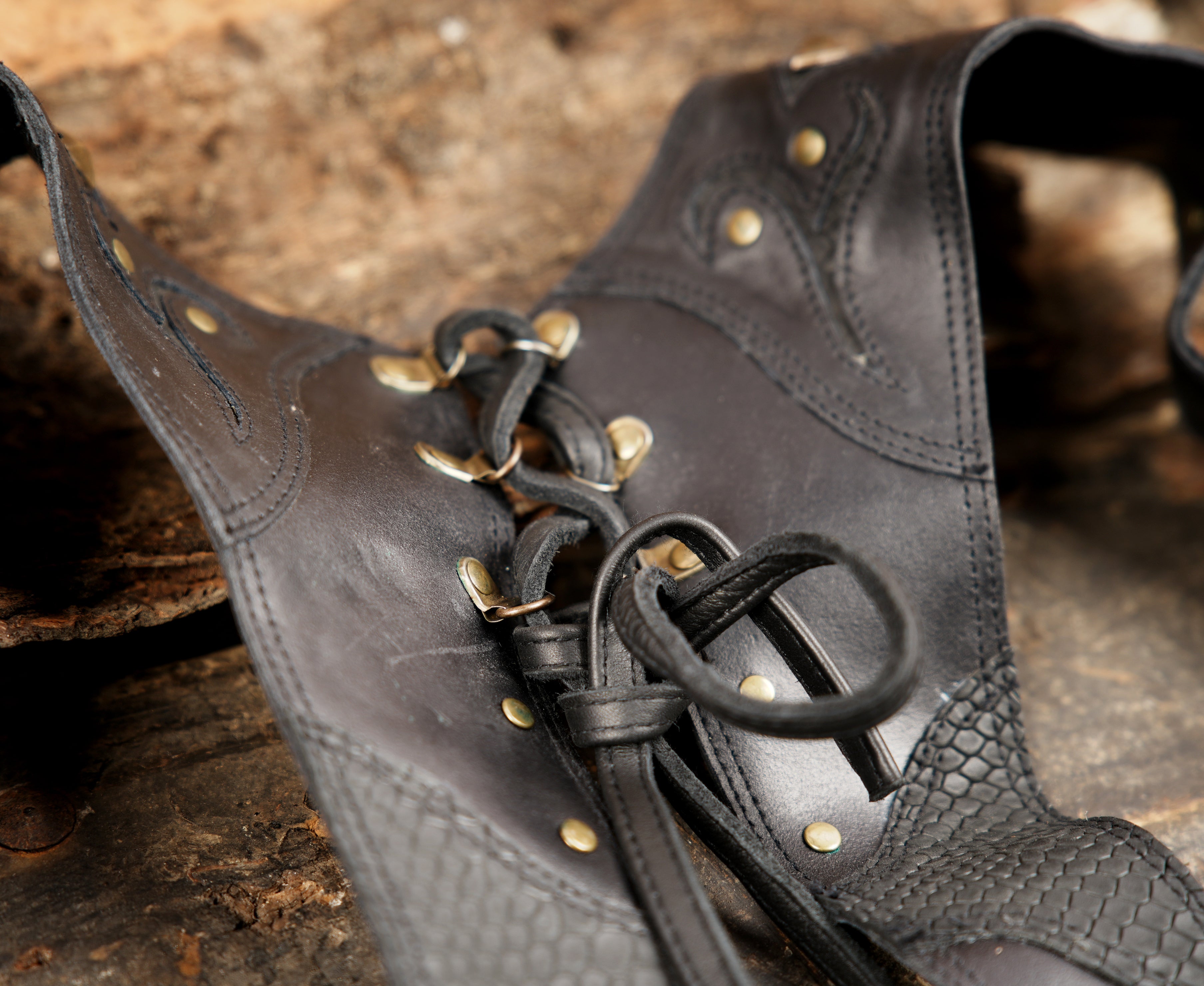 Artisan leather shoulder holster with stud accents and zipper front