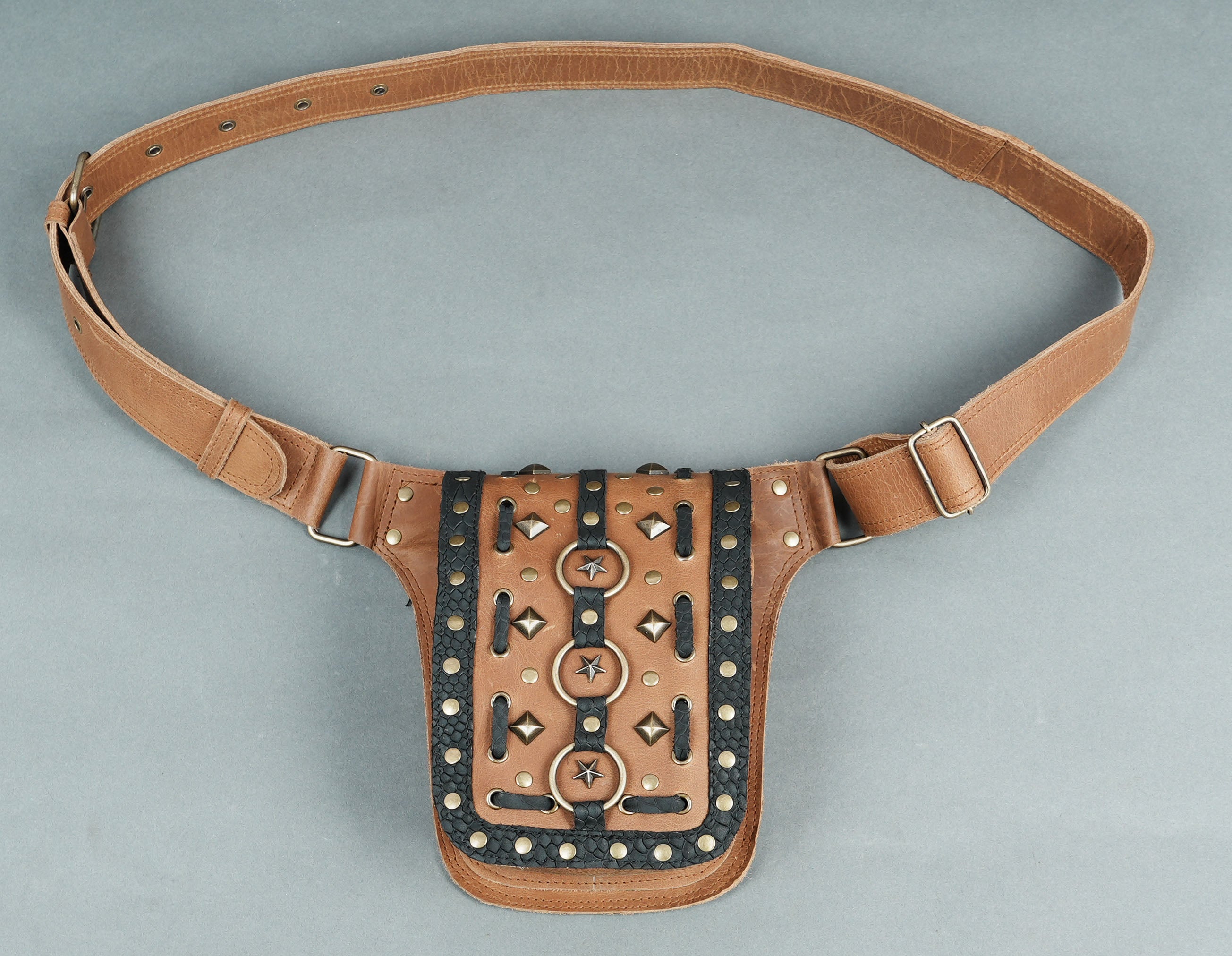 Ethnic and bohemian leather waist belt with detailed craftsmanship.