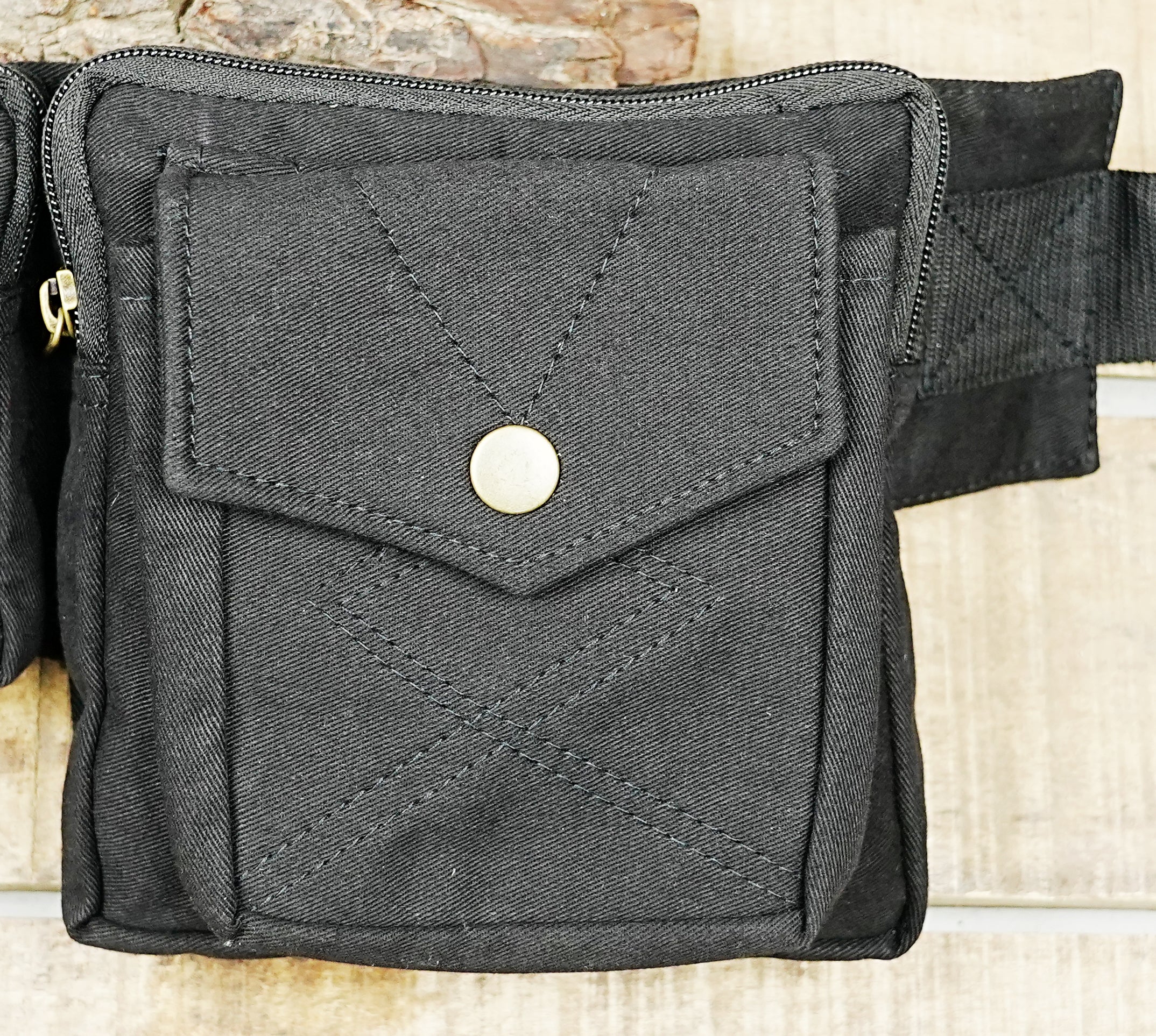 Black tactical waist pouch with multiple compartments for hands-free travel