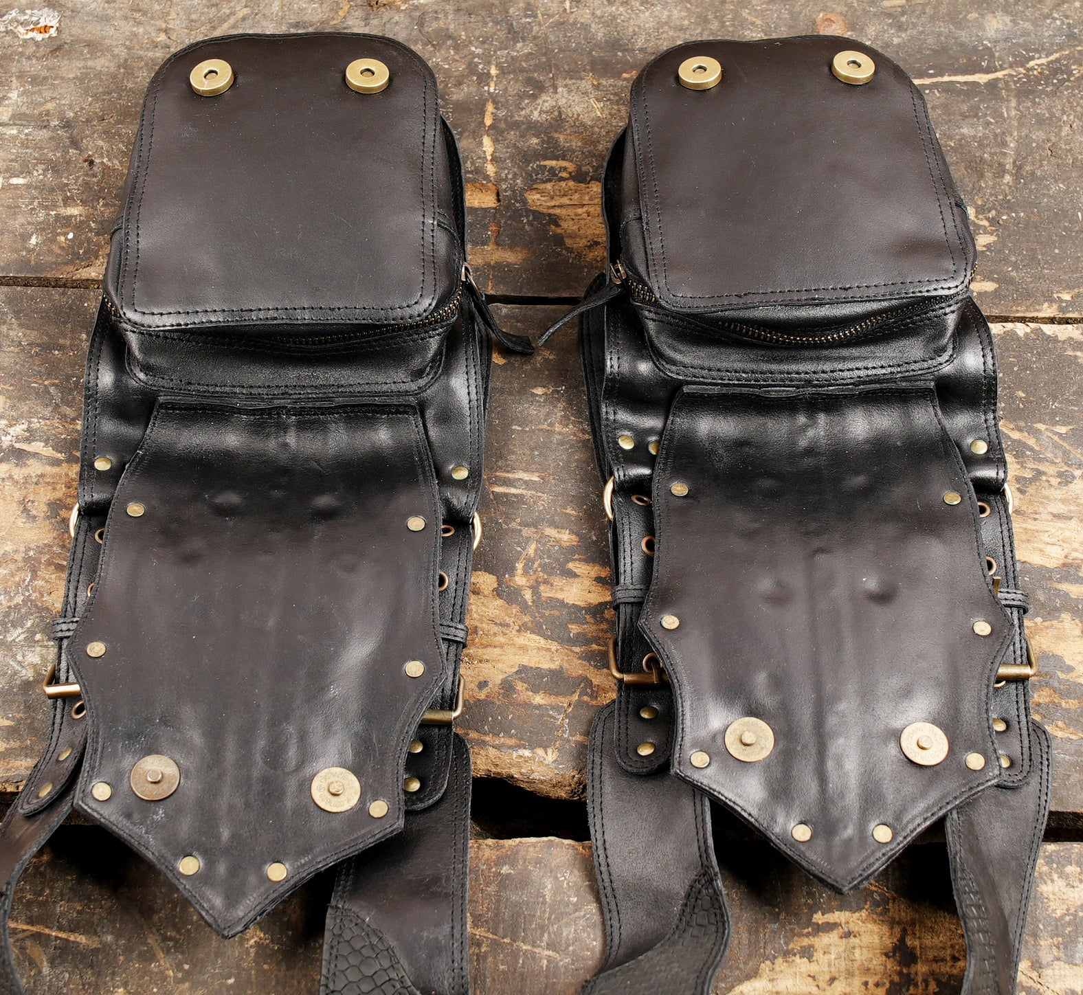 Black leather harness holster featuring studded embellishments