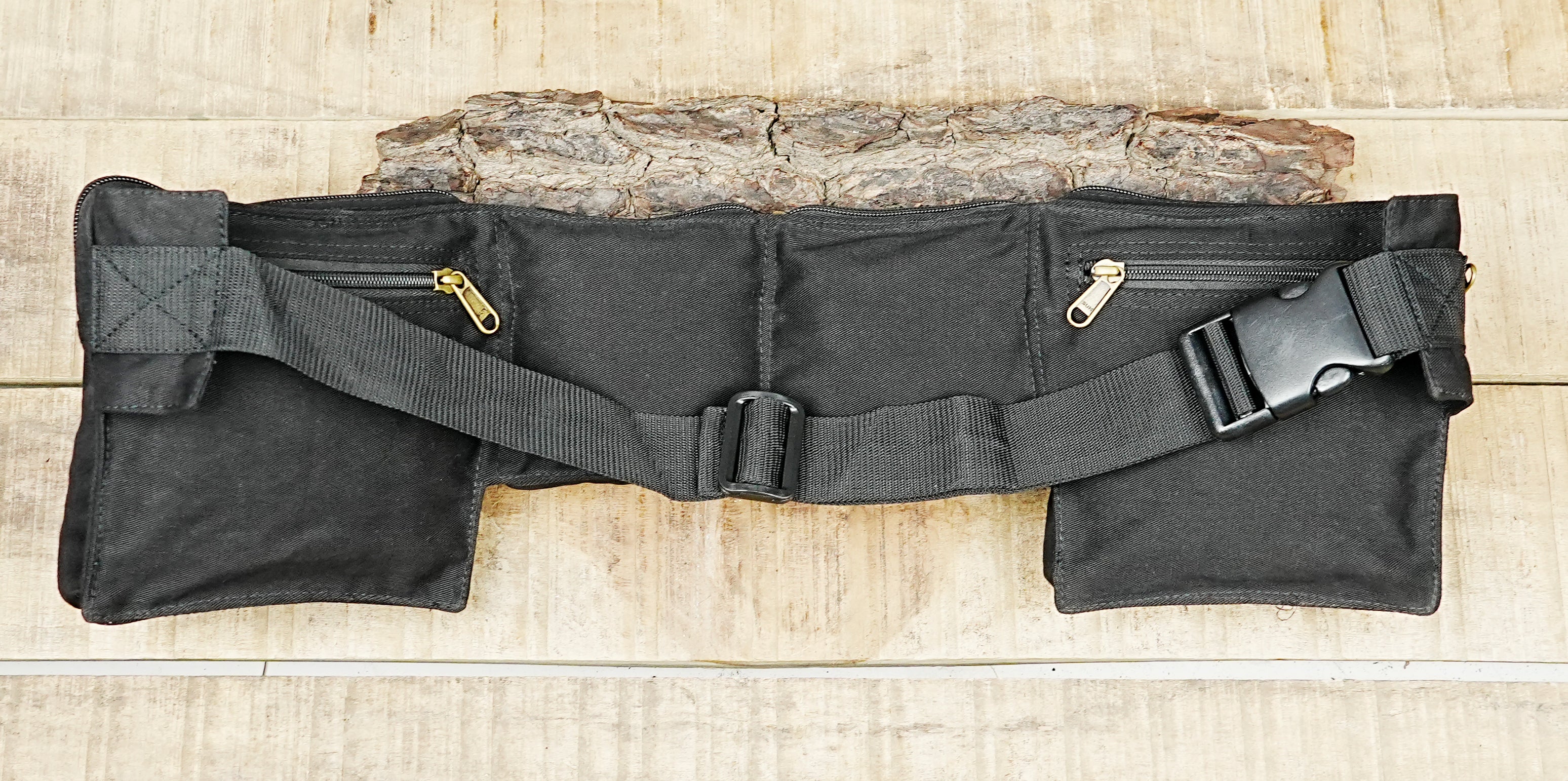 Black outdoor waist pack with adjustable belt for hiking, walking, and city wear
