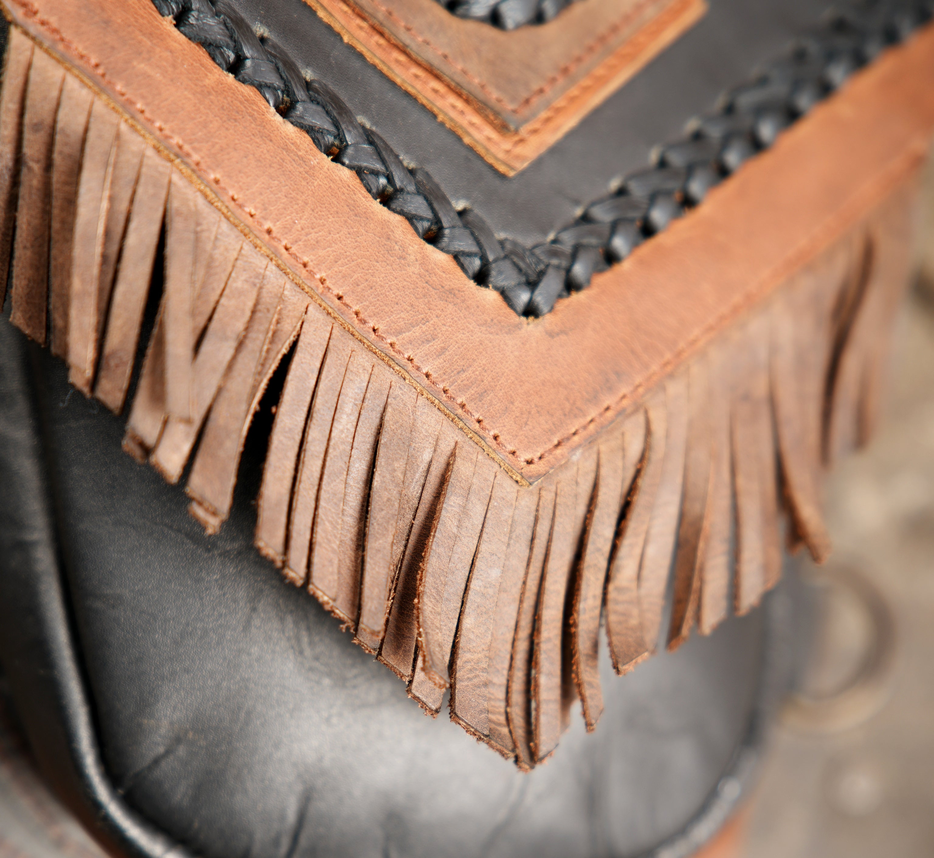 Western style leather holster with decorative fringe
