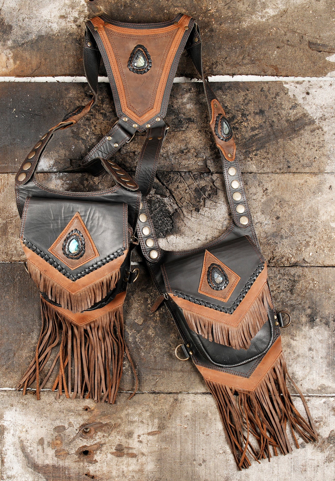 Rustic leather holster bag with fringe and braided edging