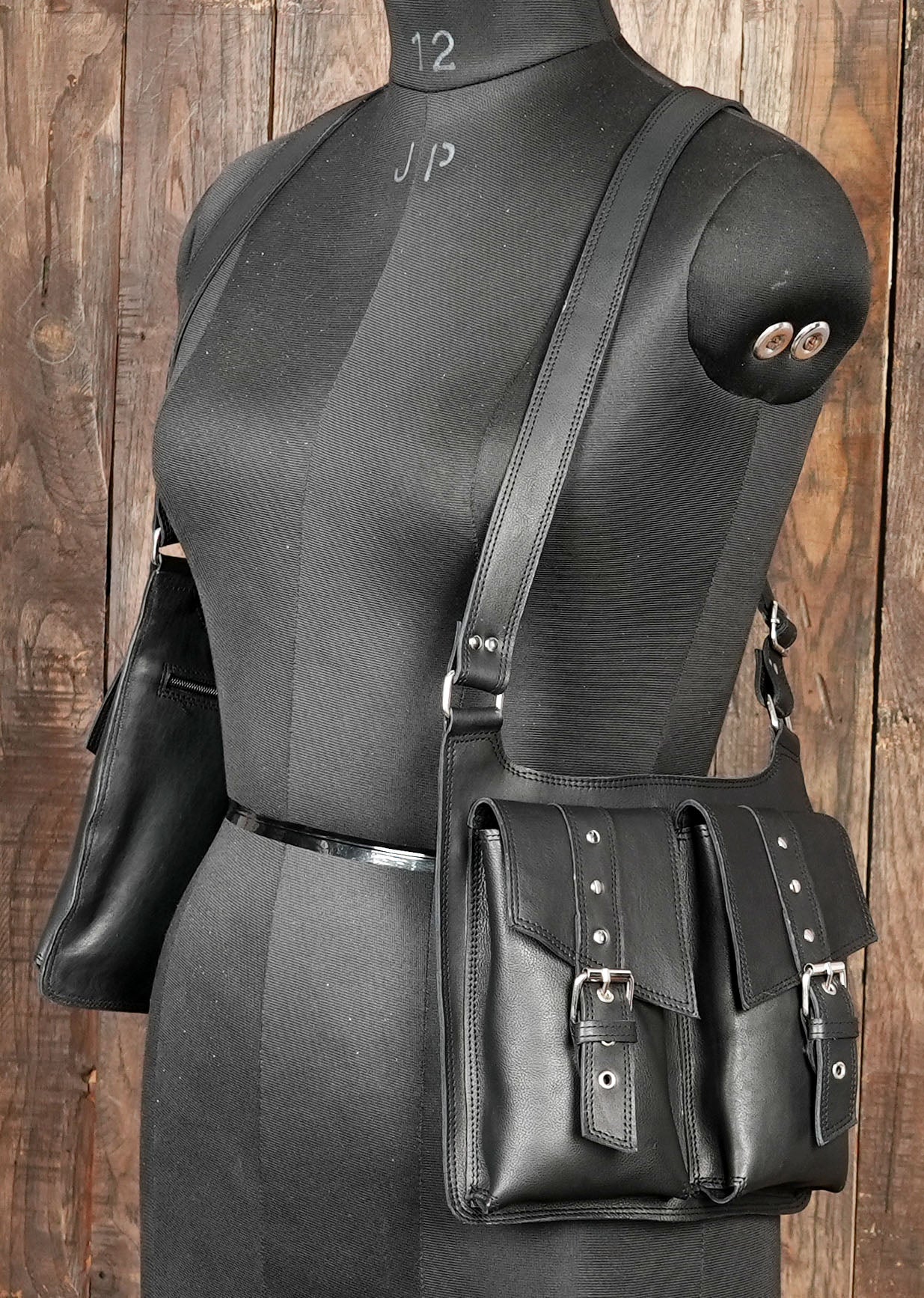 Black leather utility holster with secure flap and buckle closures