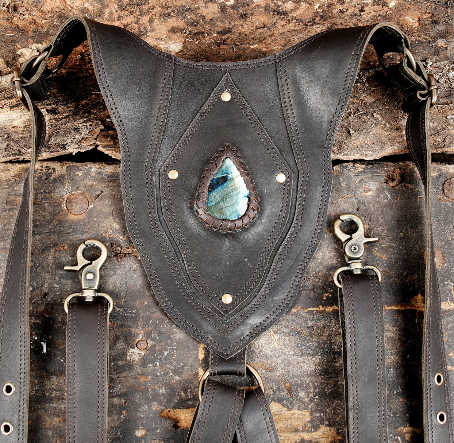 "Dual pocket leather holster with artistic layered design"