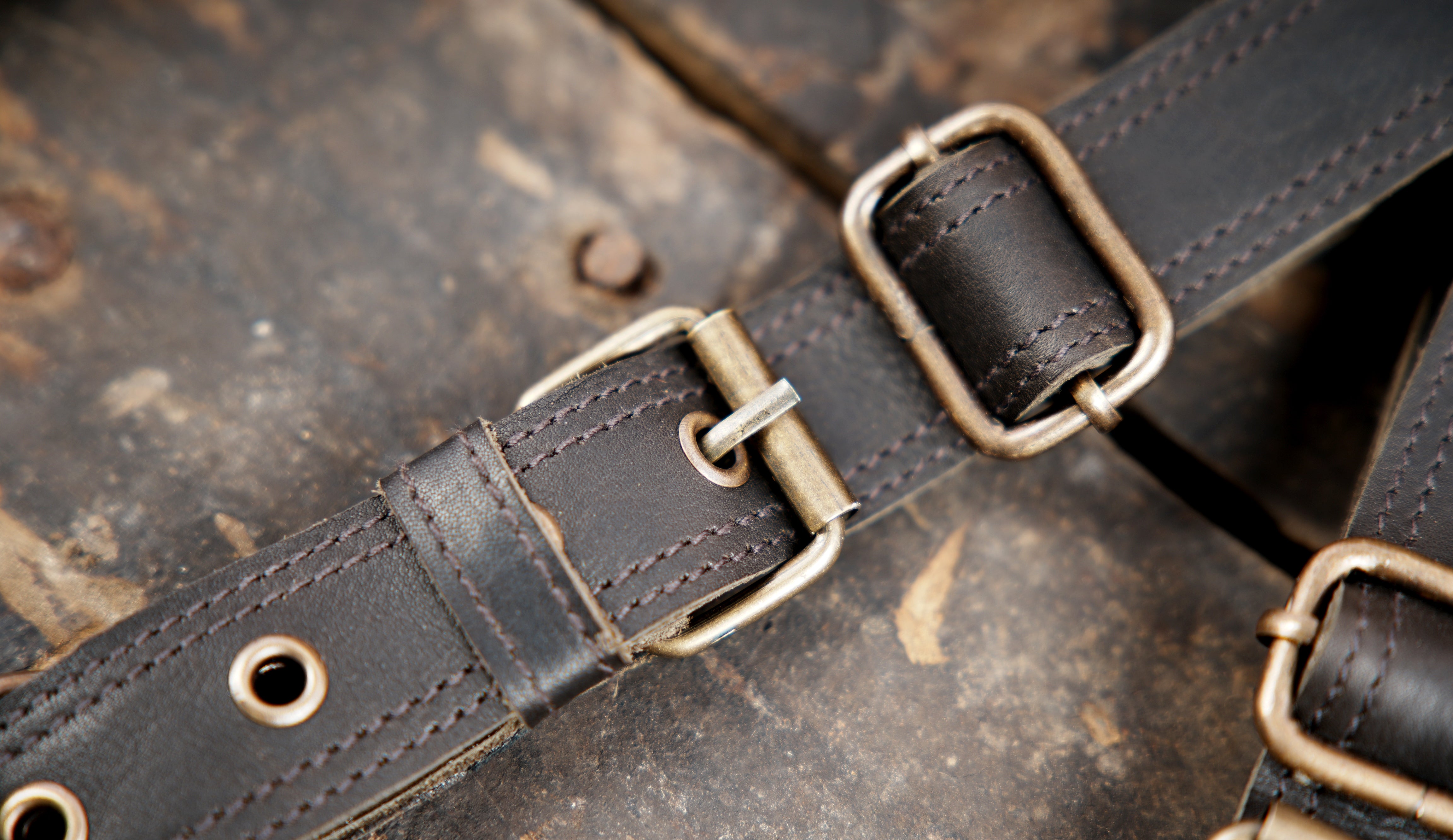 "Handmade leather holster set with blue stone accents"