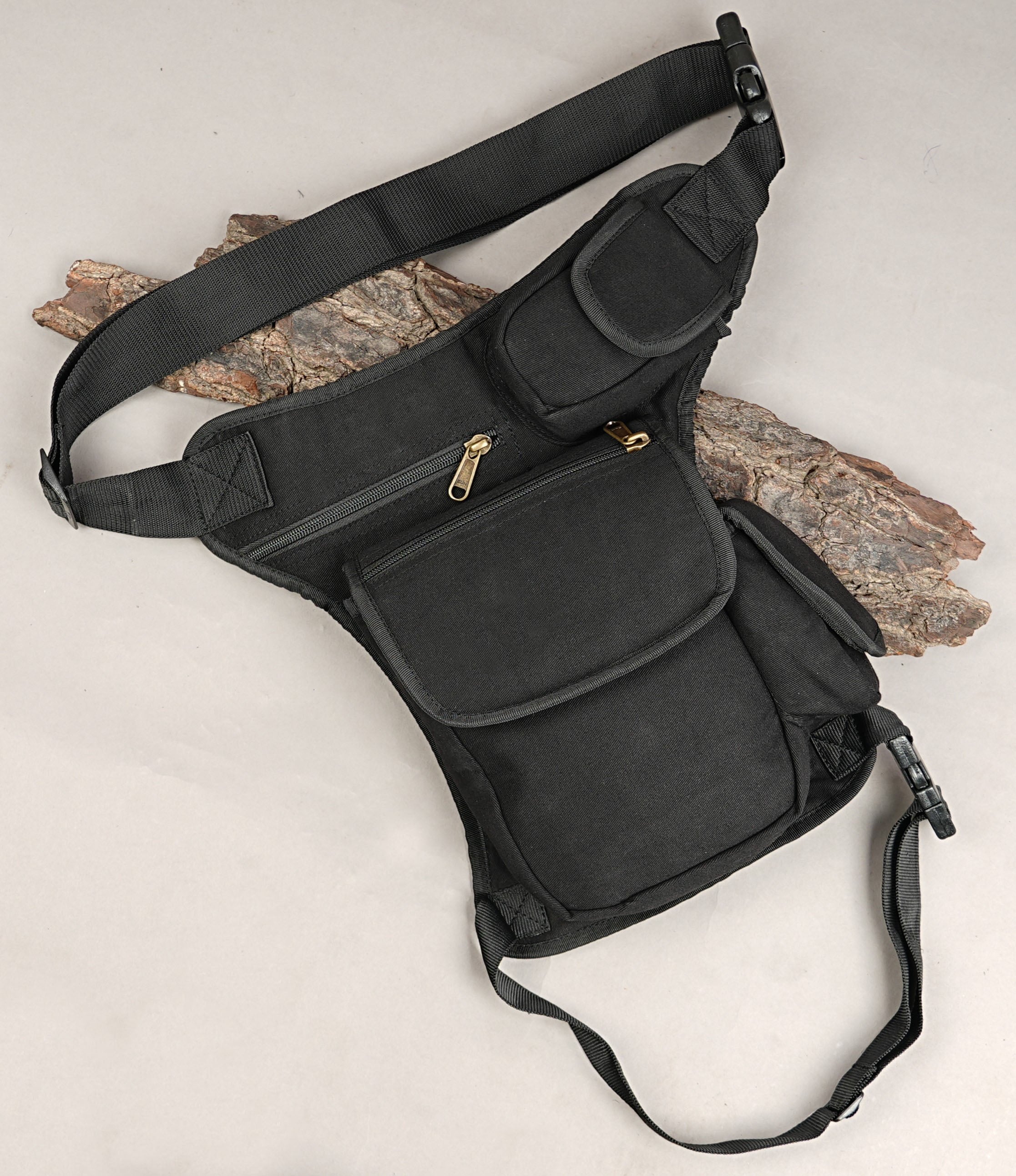 Utility drop leg fanny pack in heavy black cotton canvas for travel and biking.