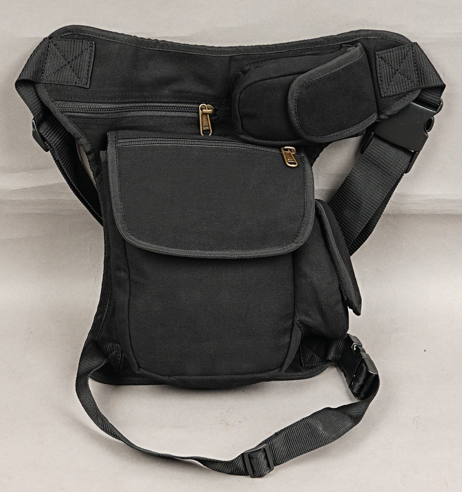 Hands-free festival utility hip pouch with quick-release waist and leg straps.