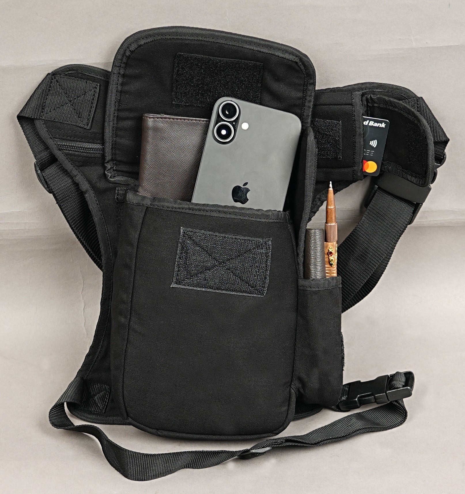 Black motorcycle drop leg pouch made from breathable handmade cotton canvas.