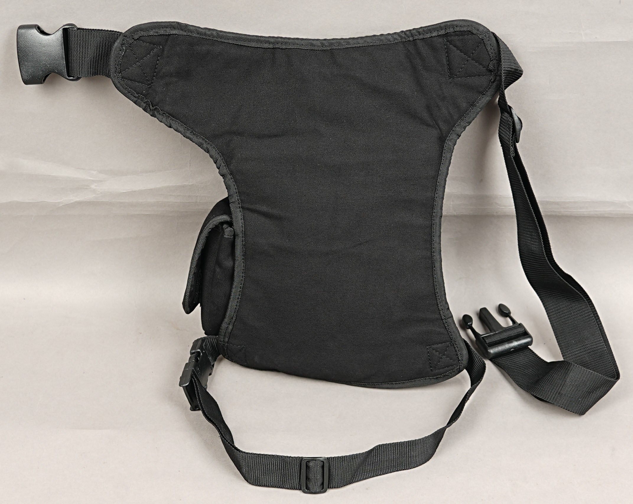 Biker style cotton thigh bag with antique brass zippers and side flap pocket.