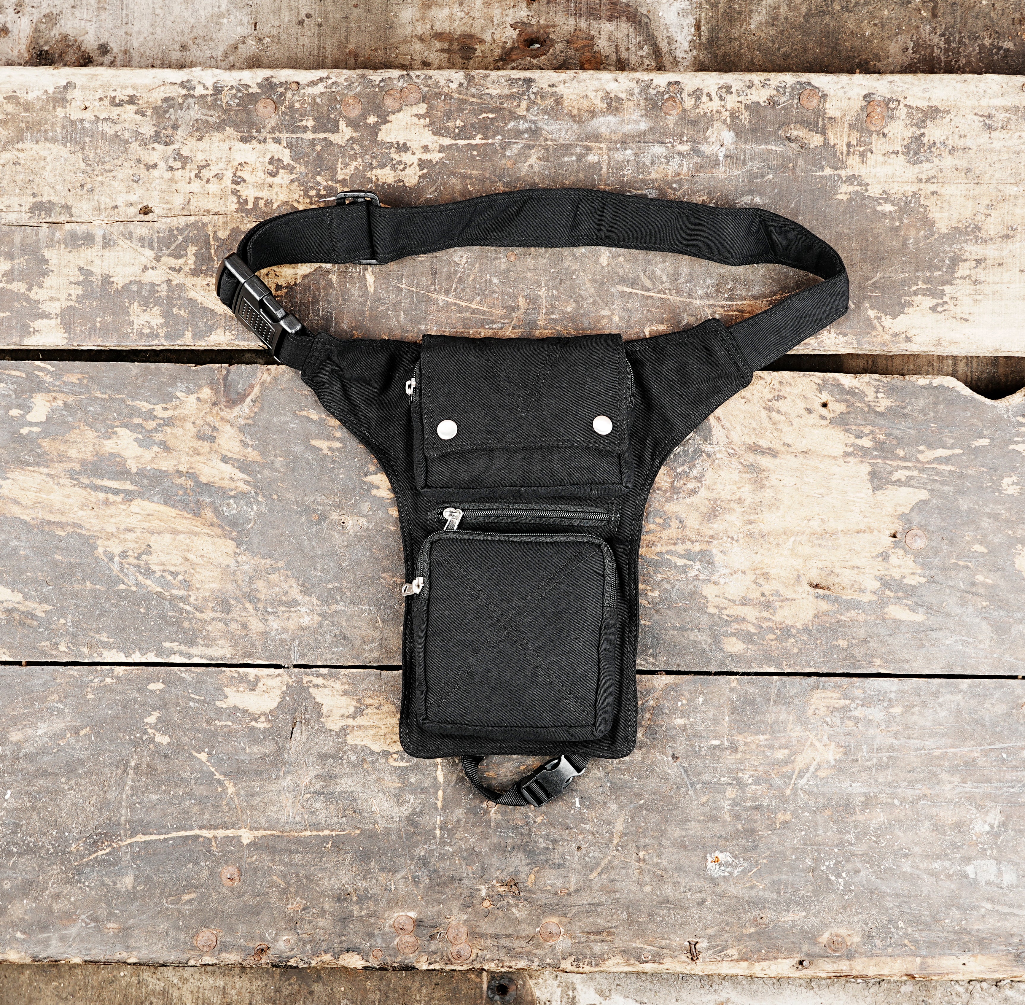 Black cotton waist to thigh strap bag with multiple pockets